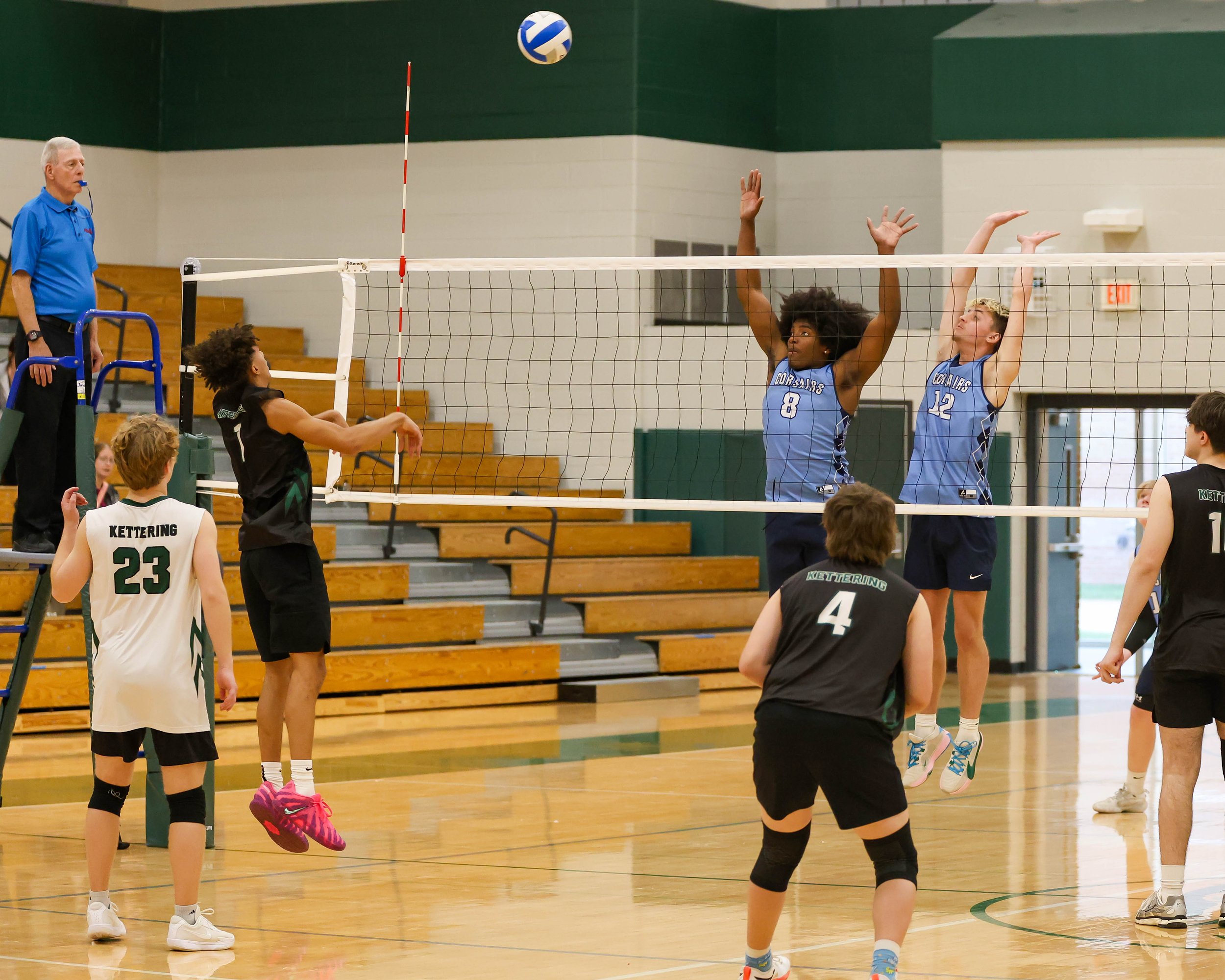 Kettering #1 lobs the ball over the net