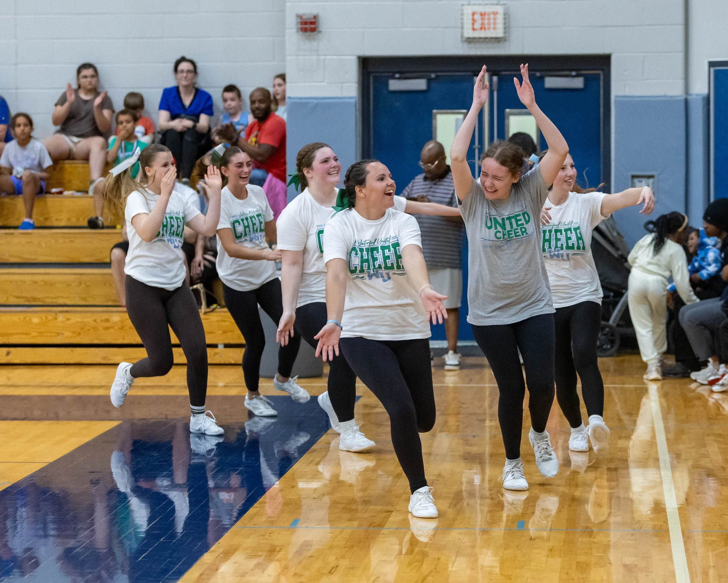Mott cheerleaders run the wave