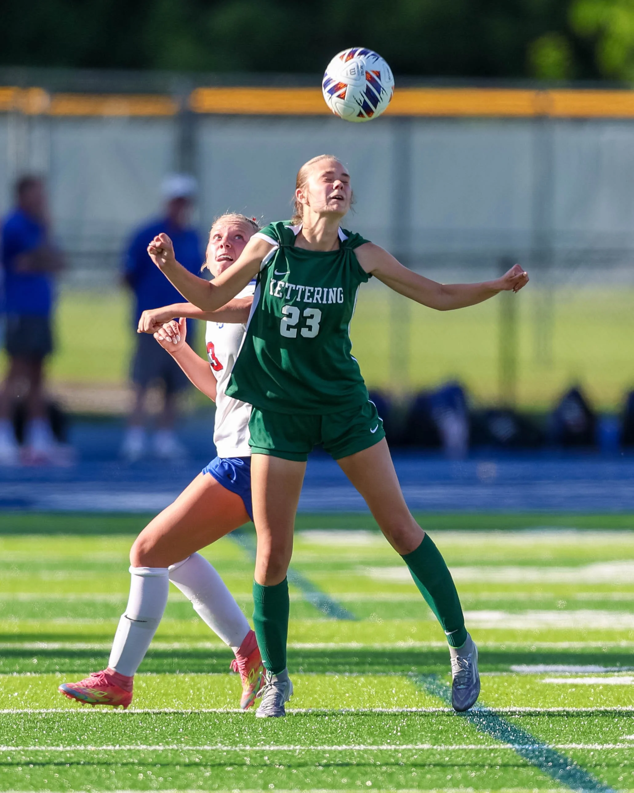 #23 heads the ball