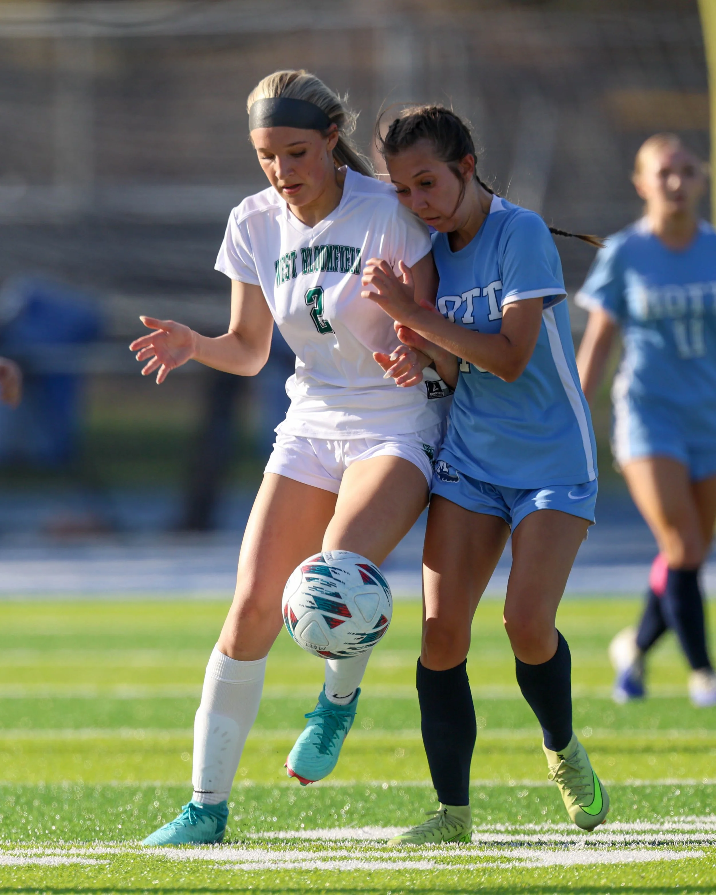 #13 battles for the ball