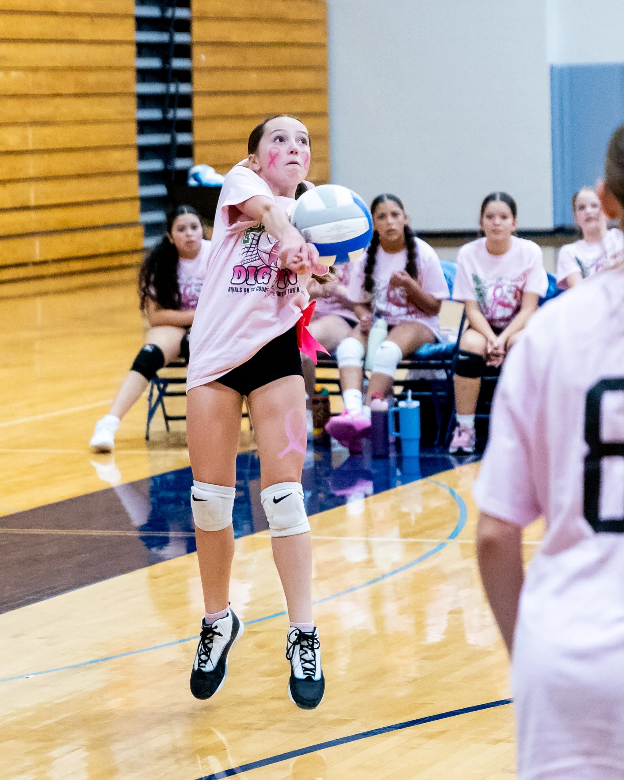 Mason player hits the ball