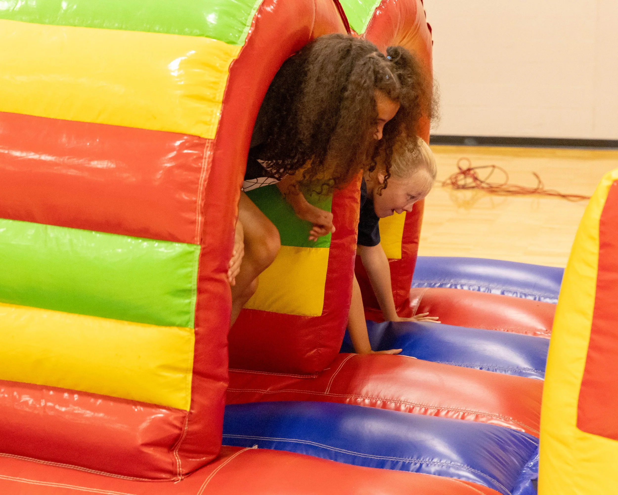 Girls out of the tunnel on the slide