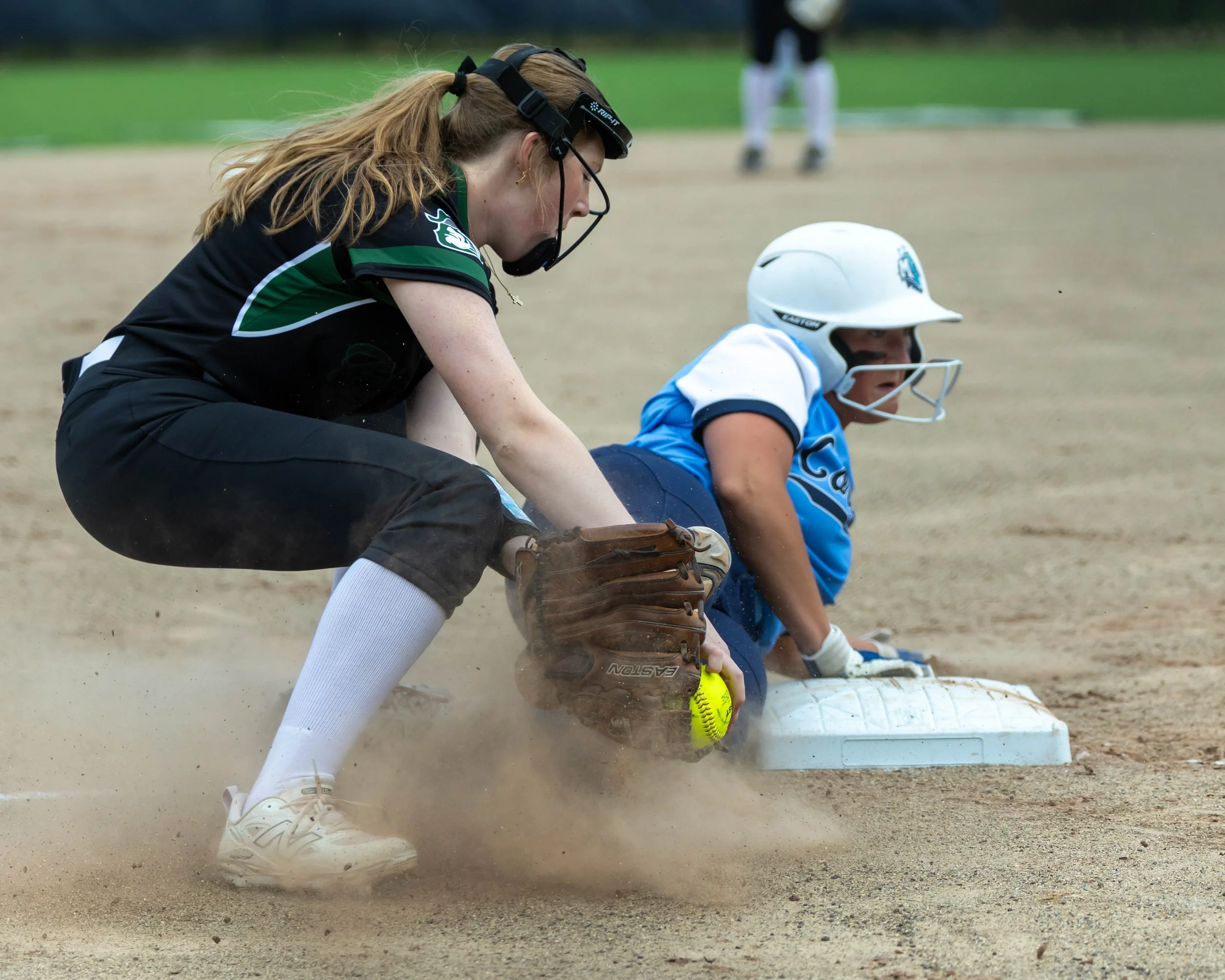 Mott #20 slides into third base 