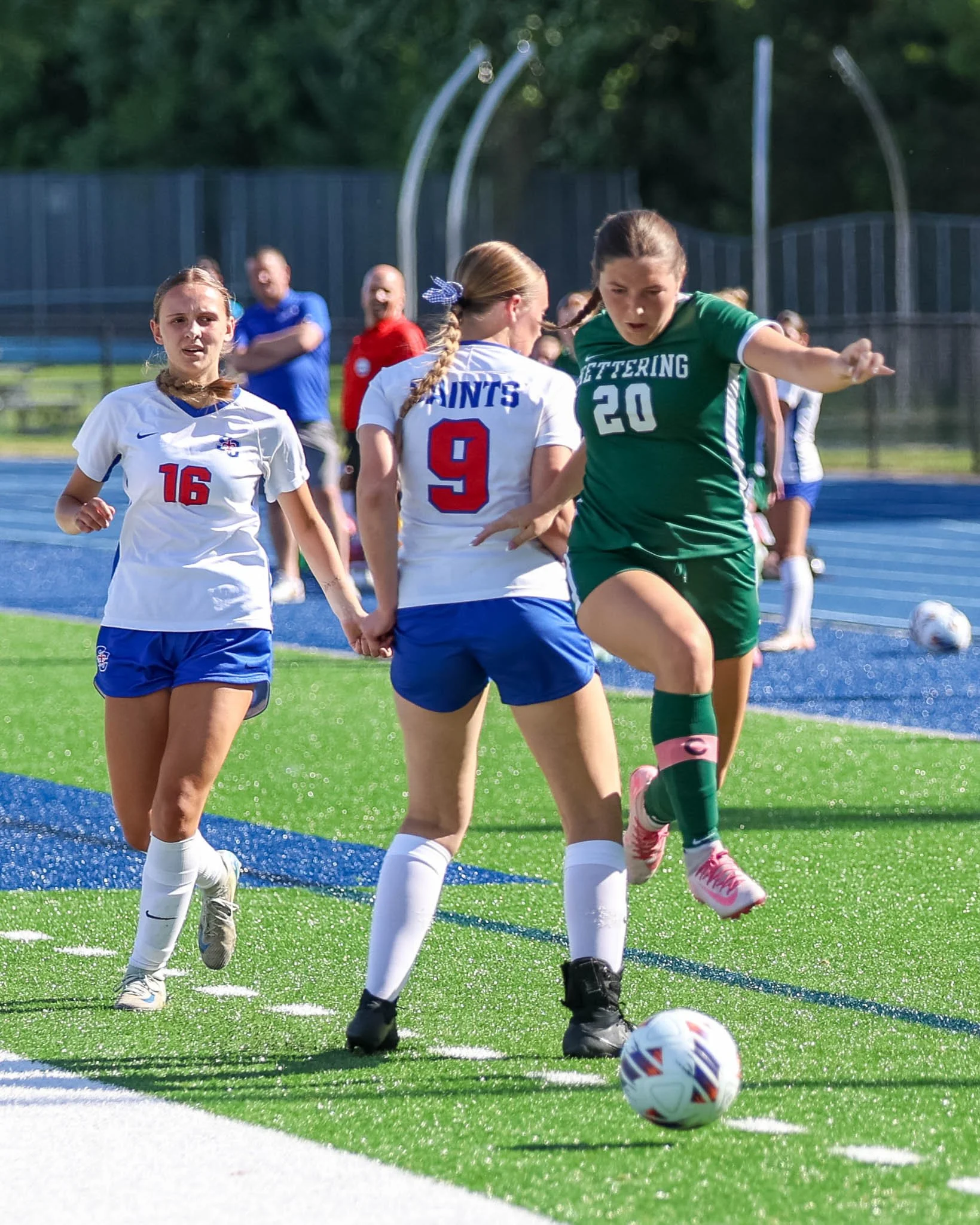 #20 jumps around the defender with the ball