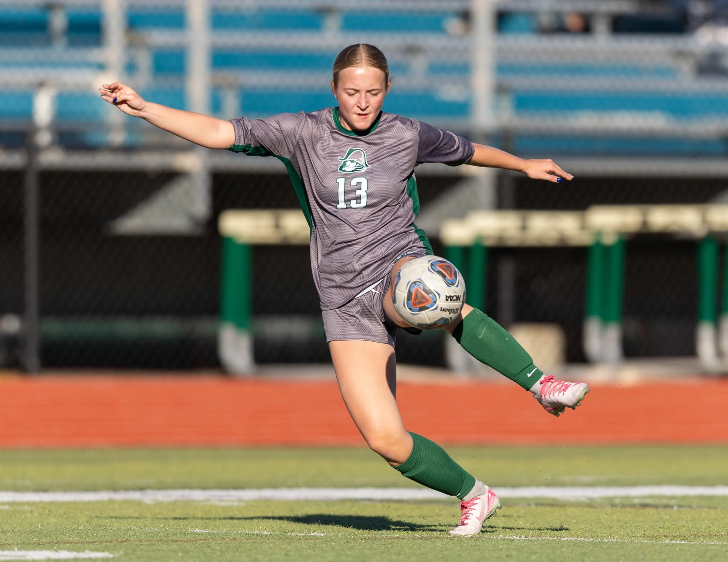 #13 kicks the ball