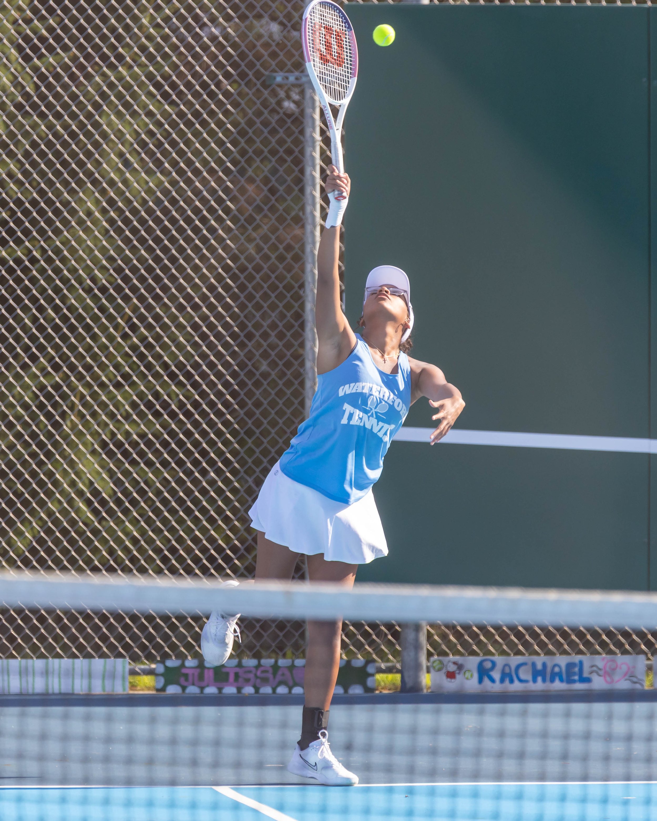 Waterford United player serves the ball