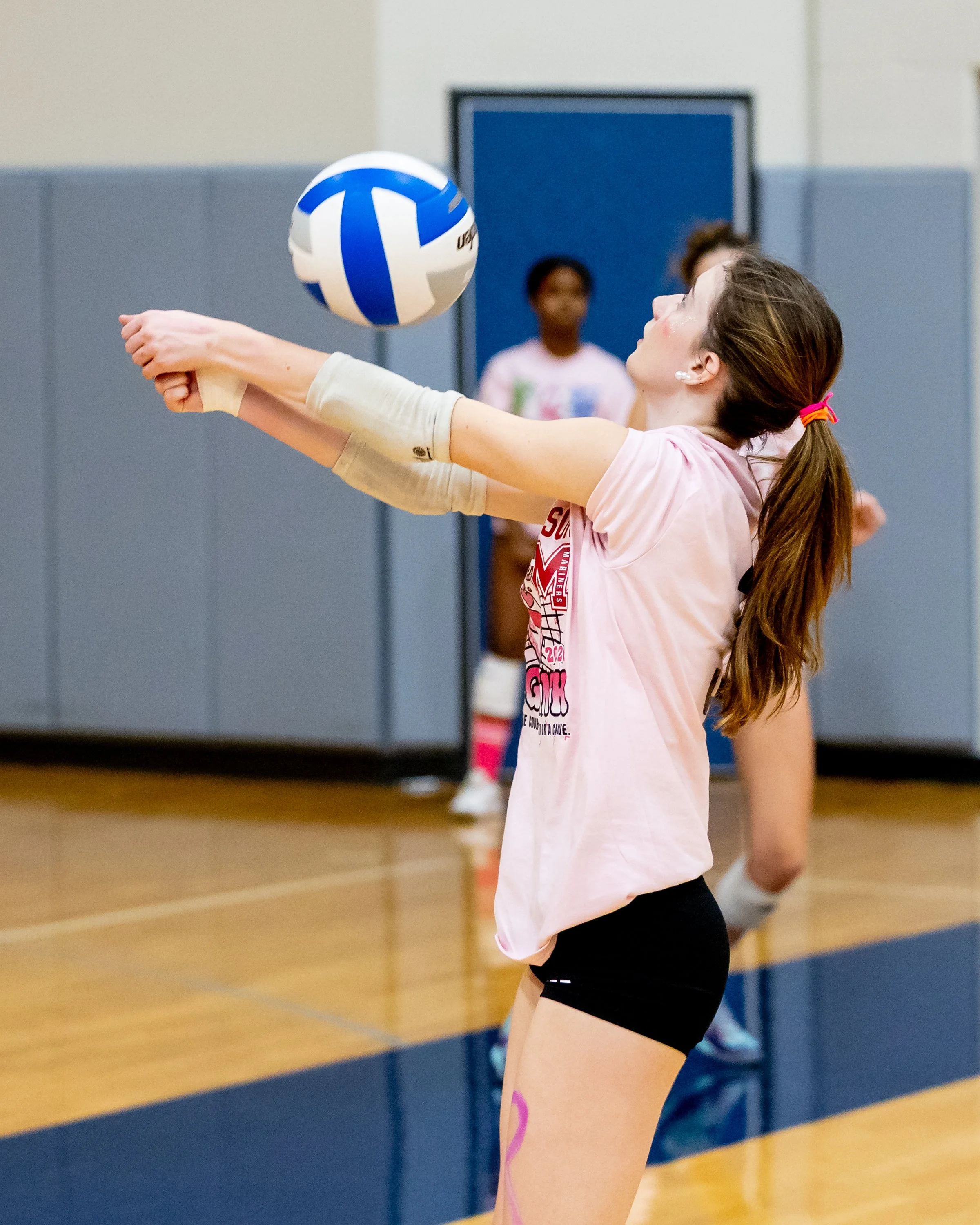 Mason player hits the ball