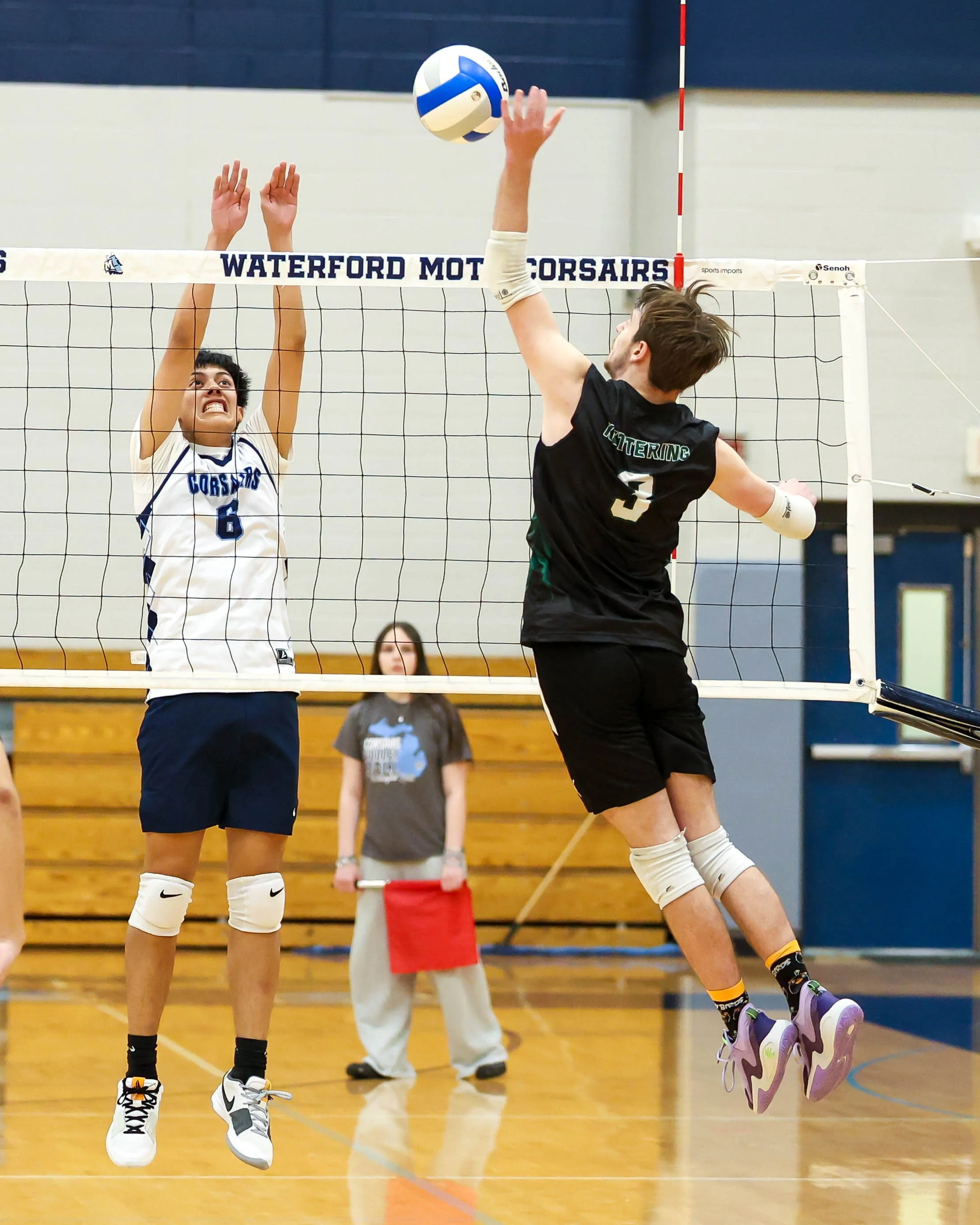 Kettering #3 spikes the ball