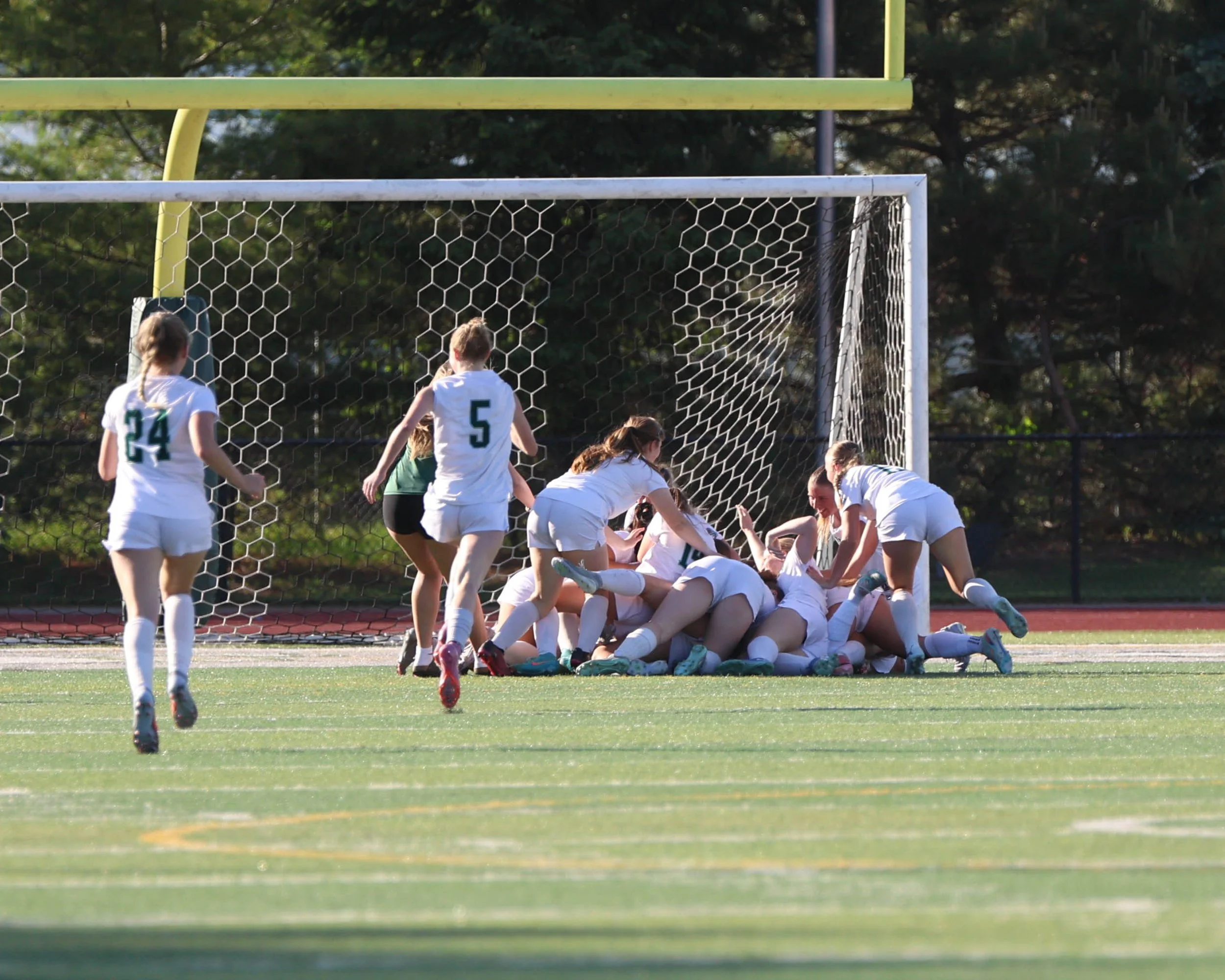 Kettering wins the game and celebrates 