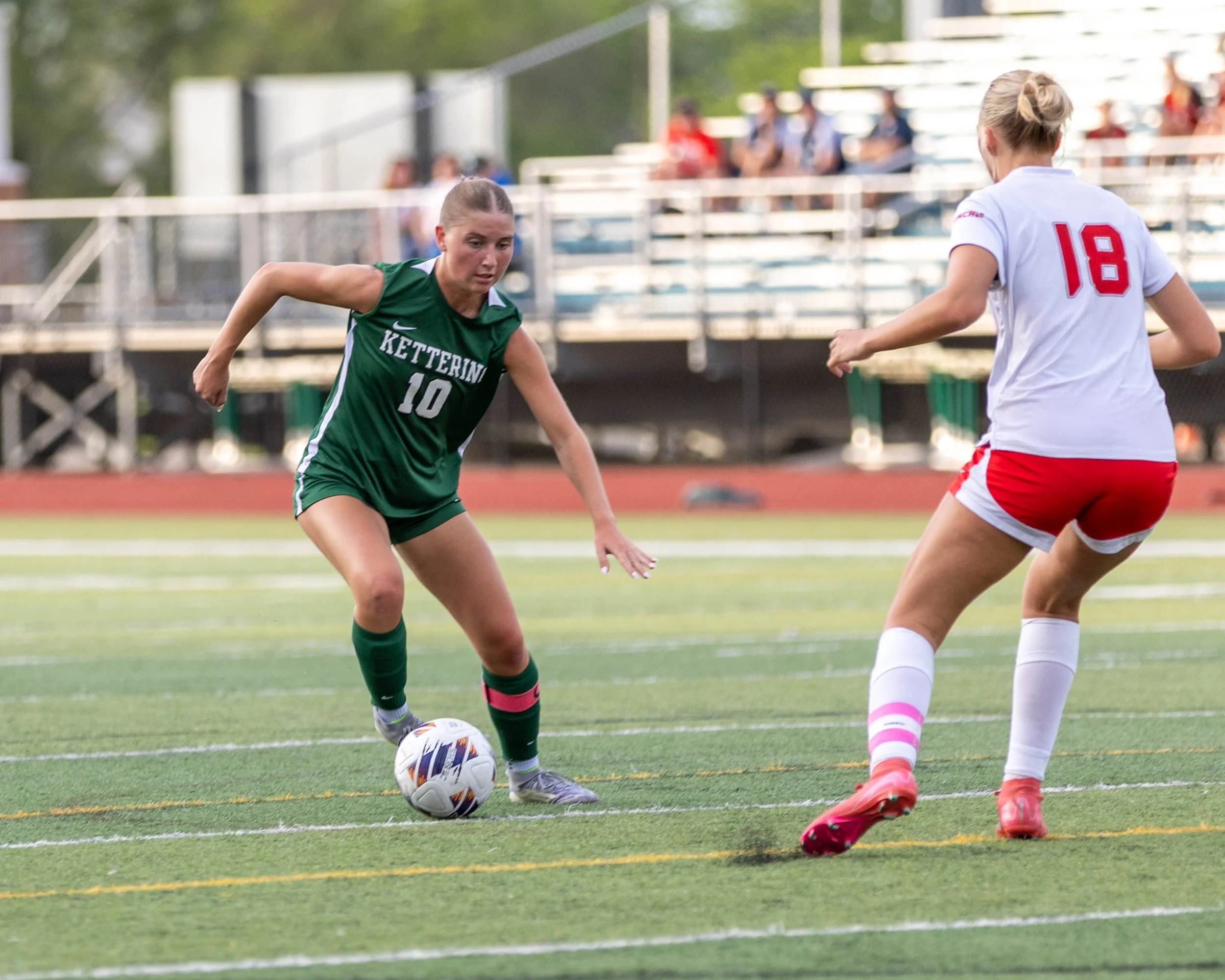 #10 cuts back with the ball around a defender
