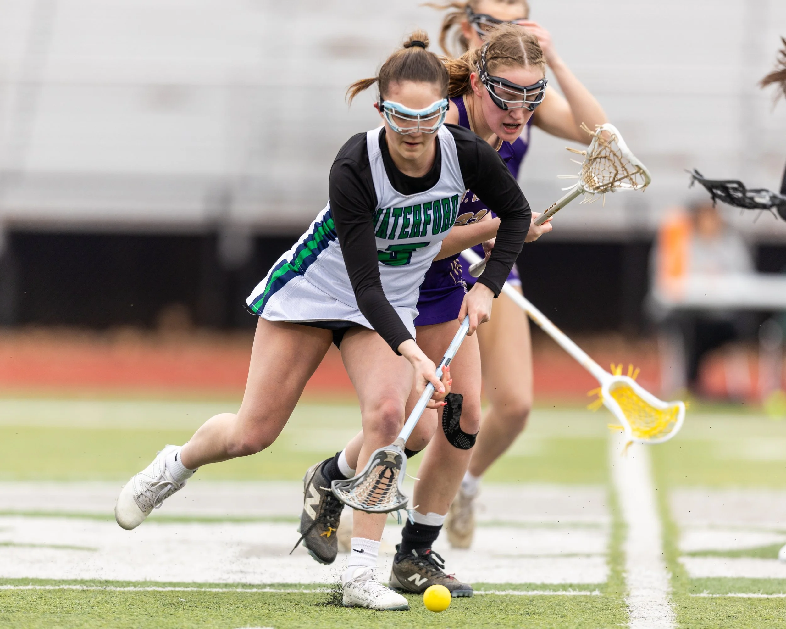 #5 looks at the ball on the ground