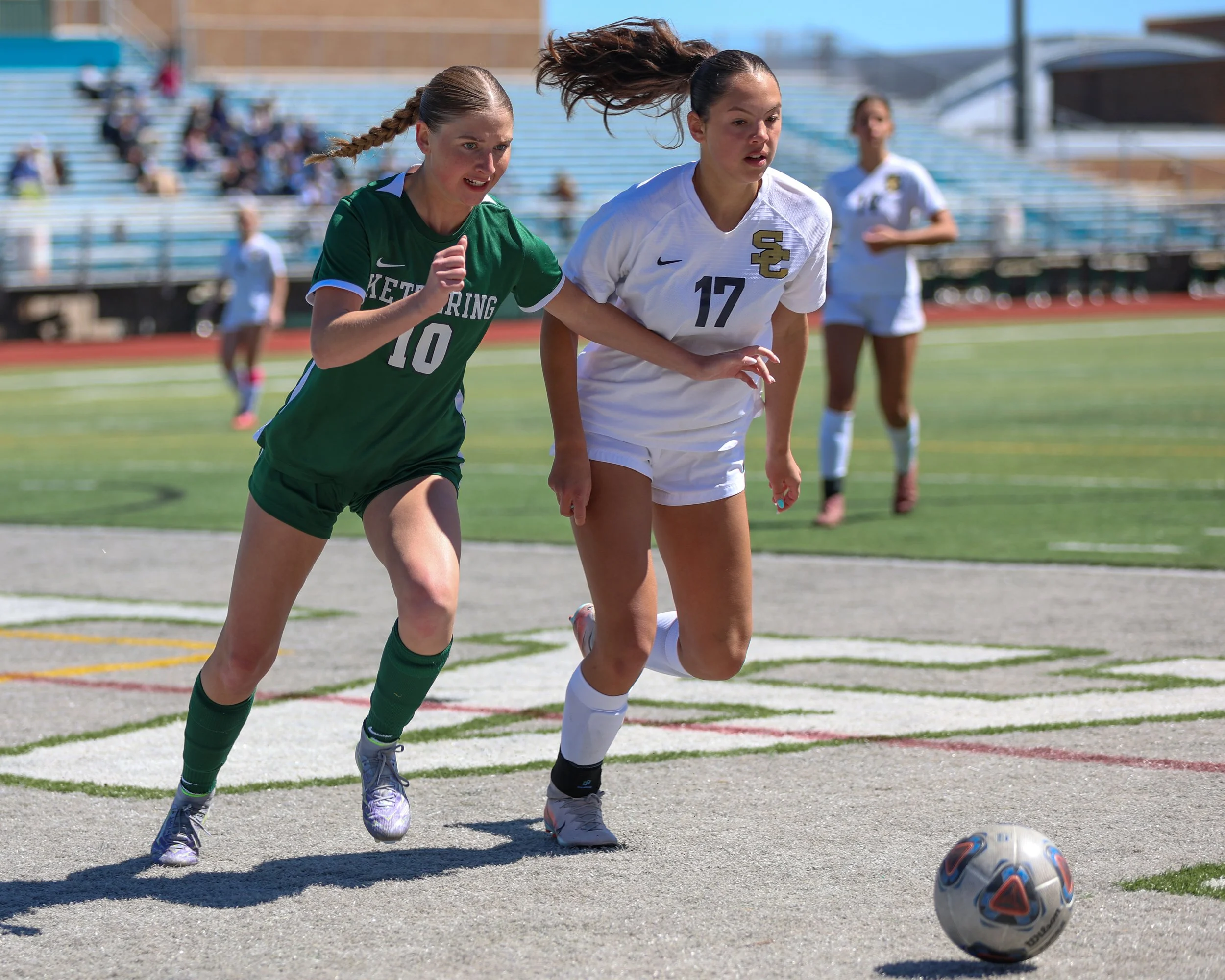 #10 and Stoney Creek #17 go for the ball