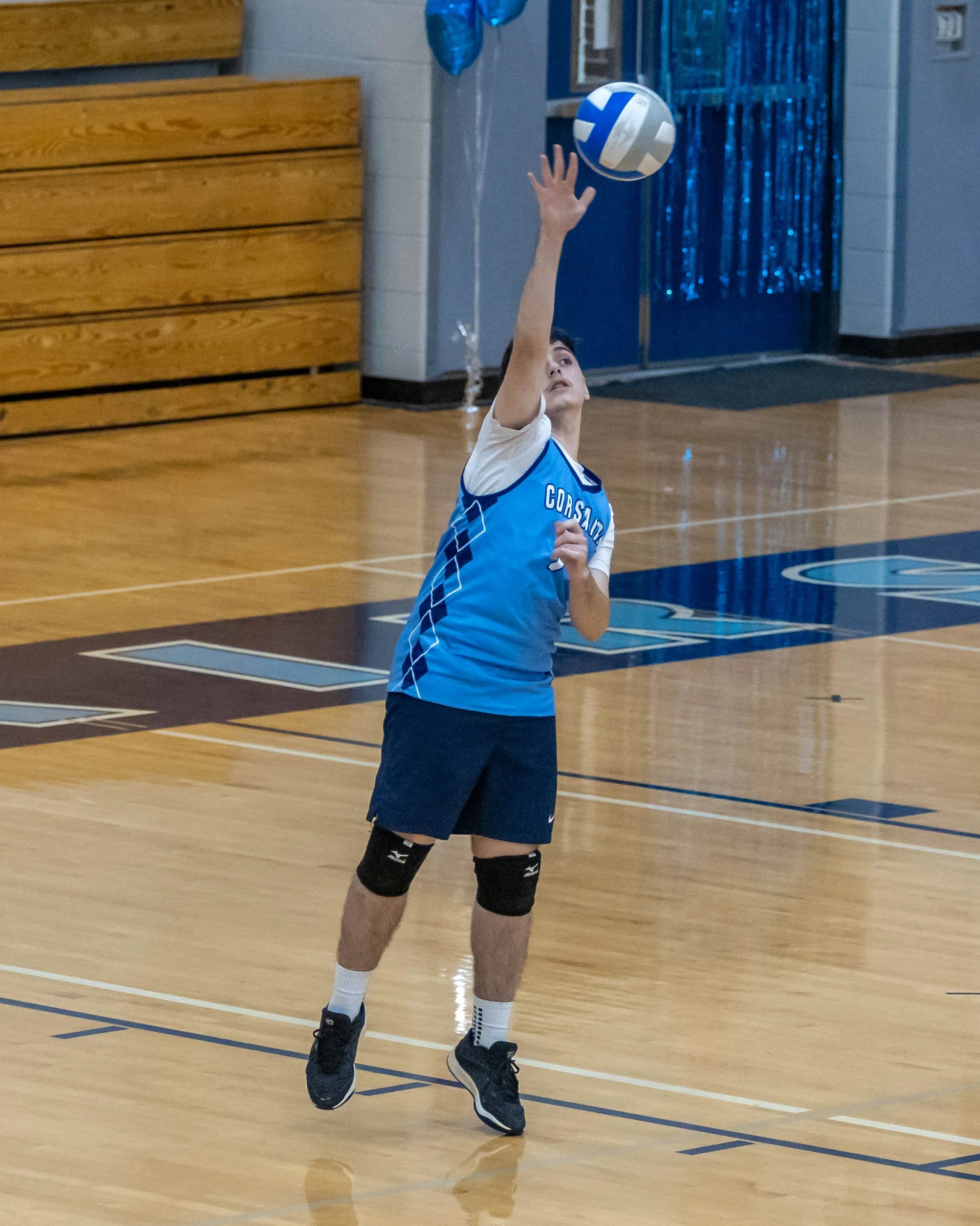 #7 serves the ball
