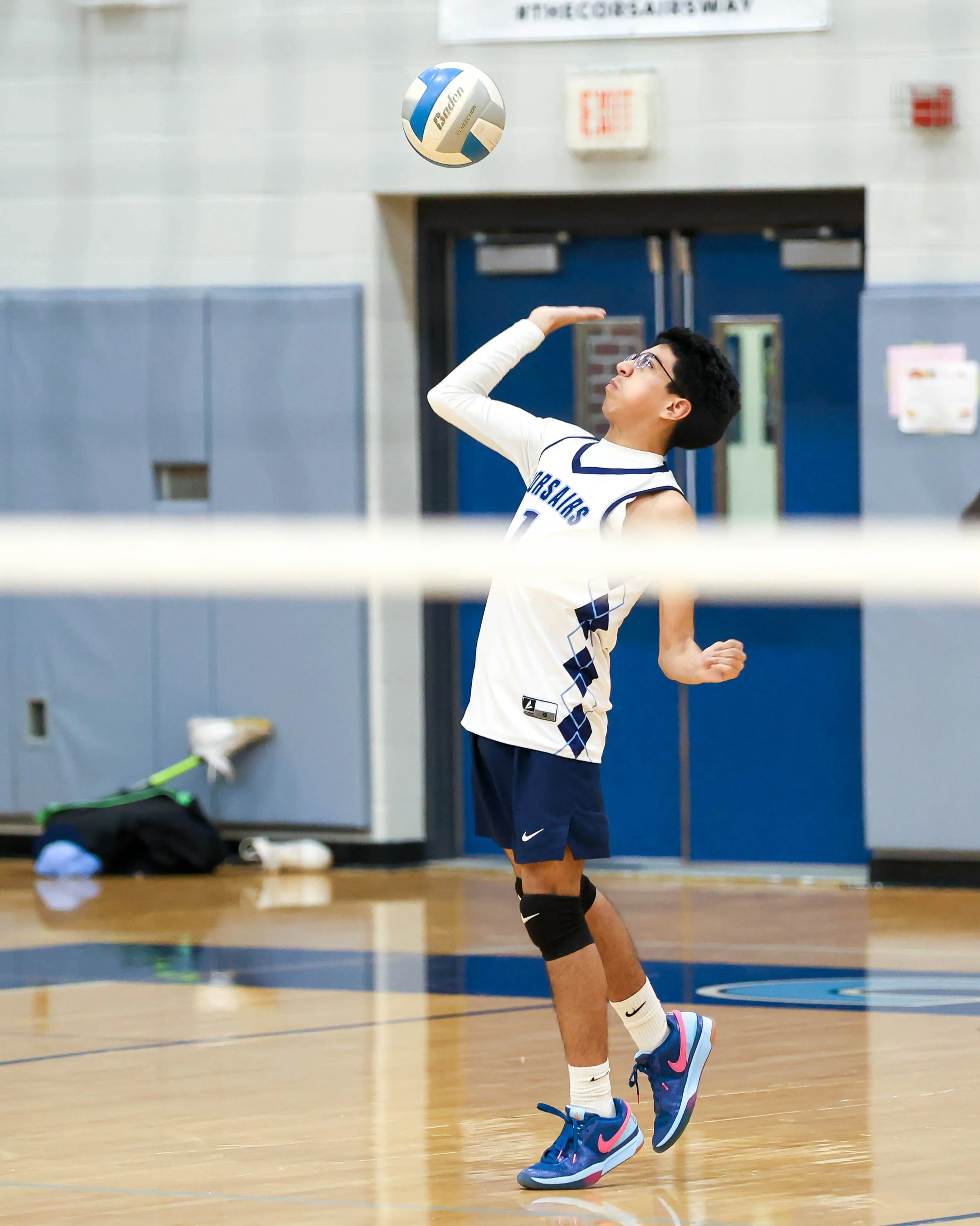 Mott #7 serves the ball