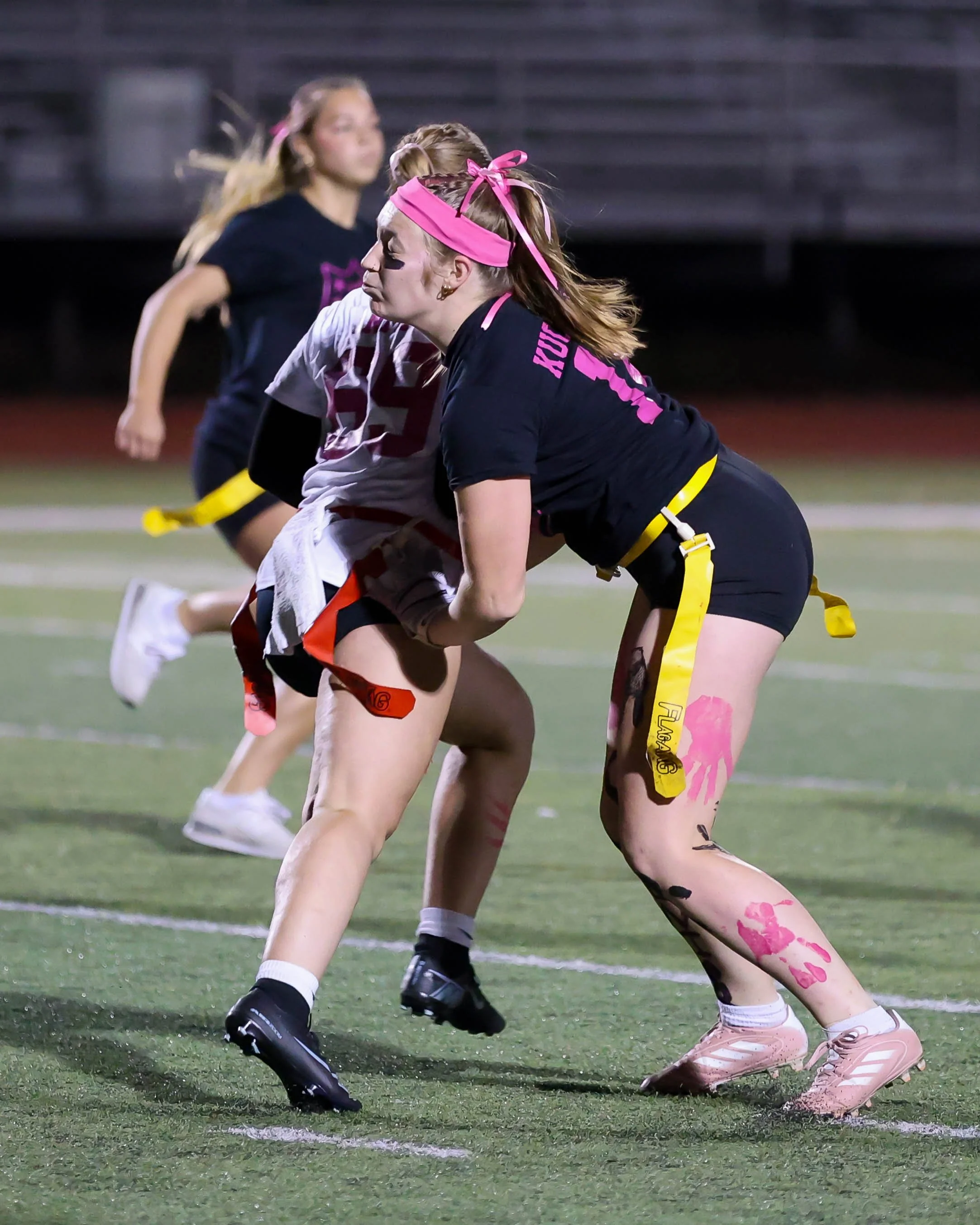 Senior defender grabs for the flag