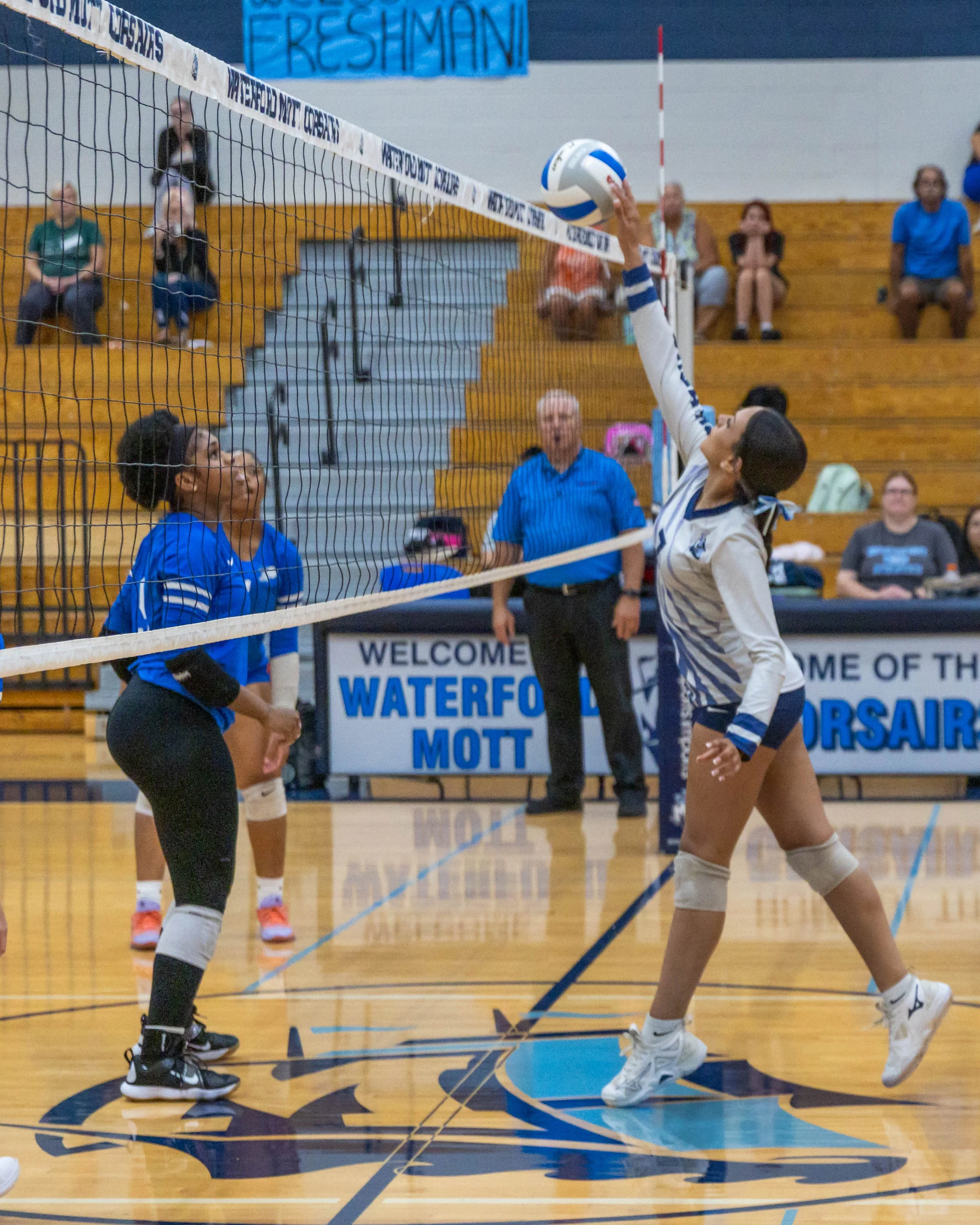 WM #7 hits the ball over the net