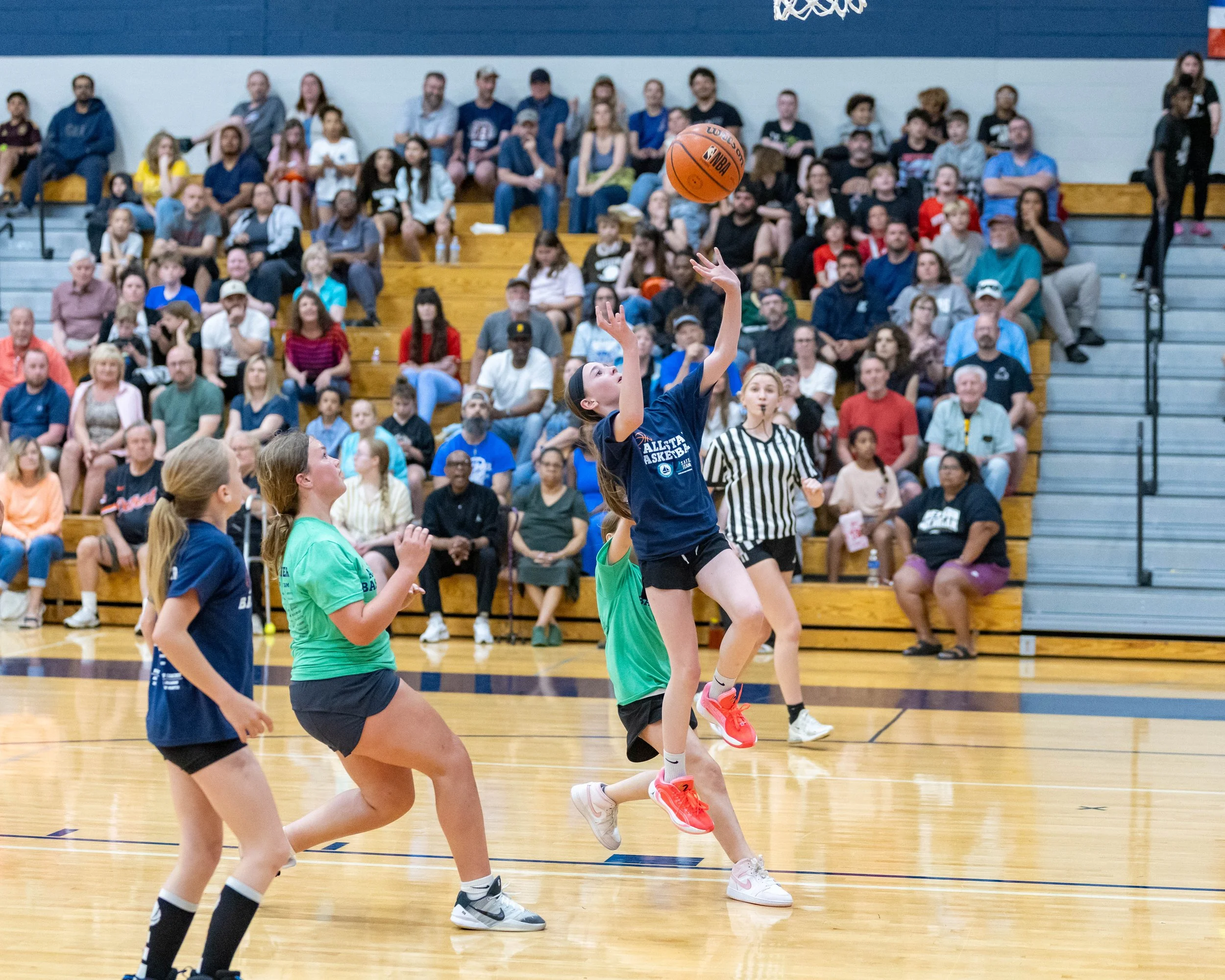North girl shoots the ball 