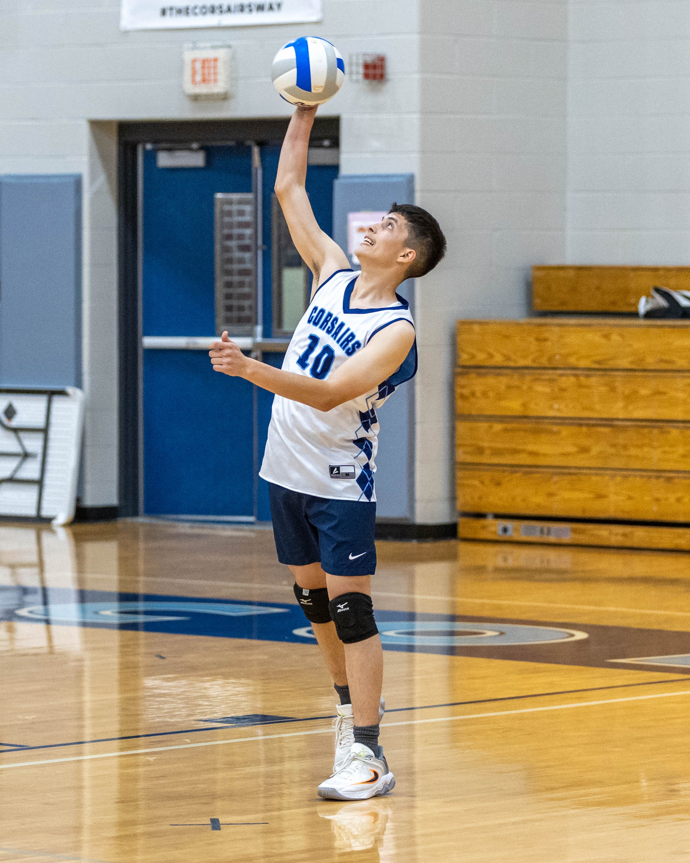 #10 serves the ball