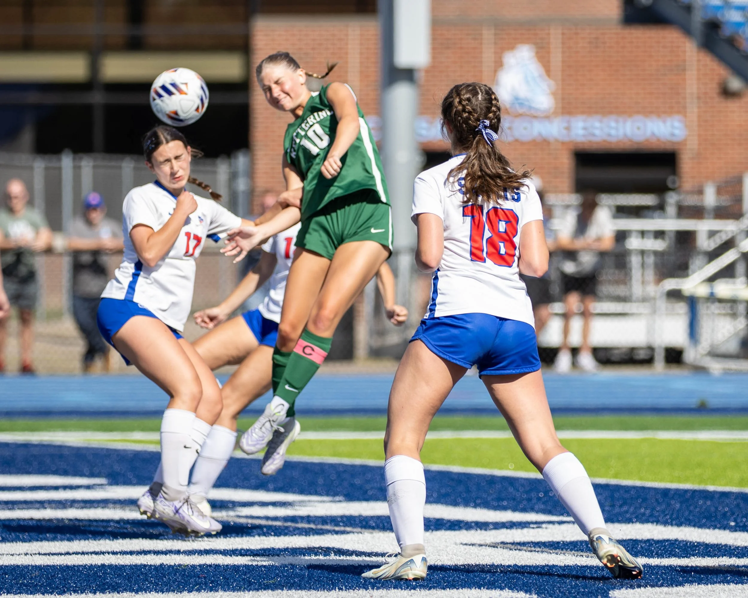 #10 heads the ball