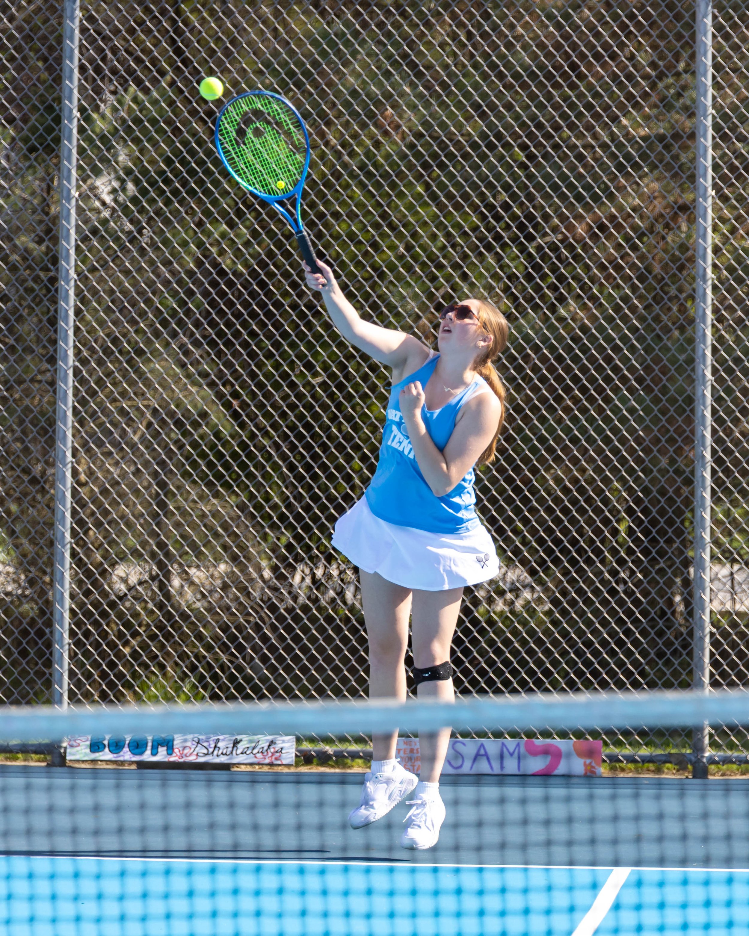 Waterford United player serves the ball