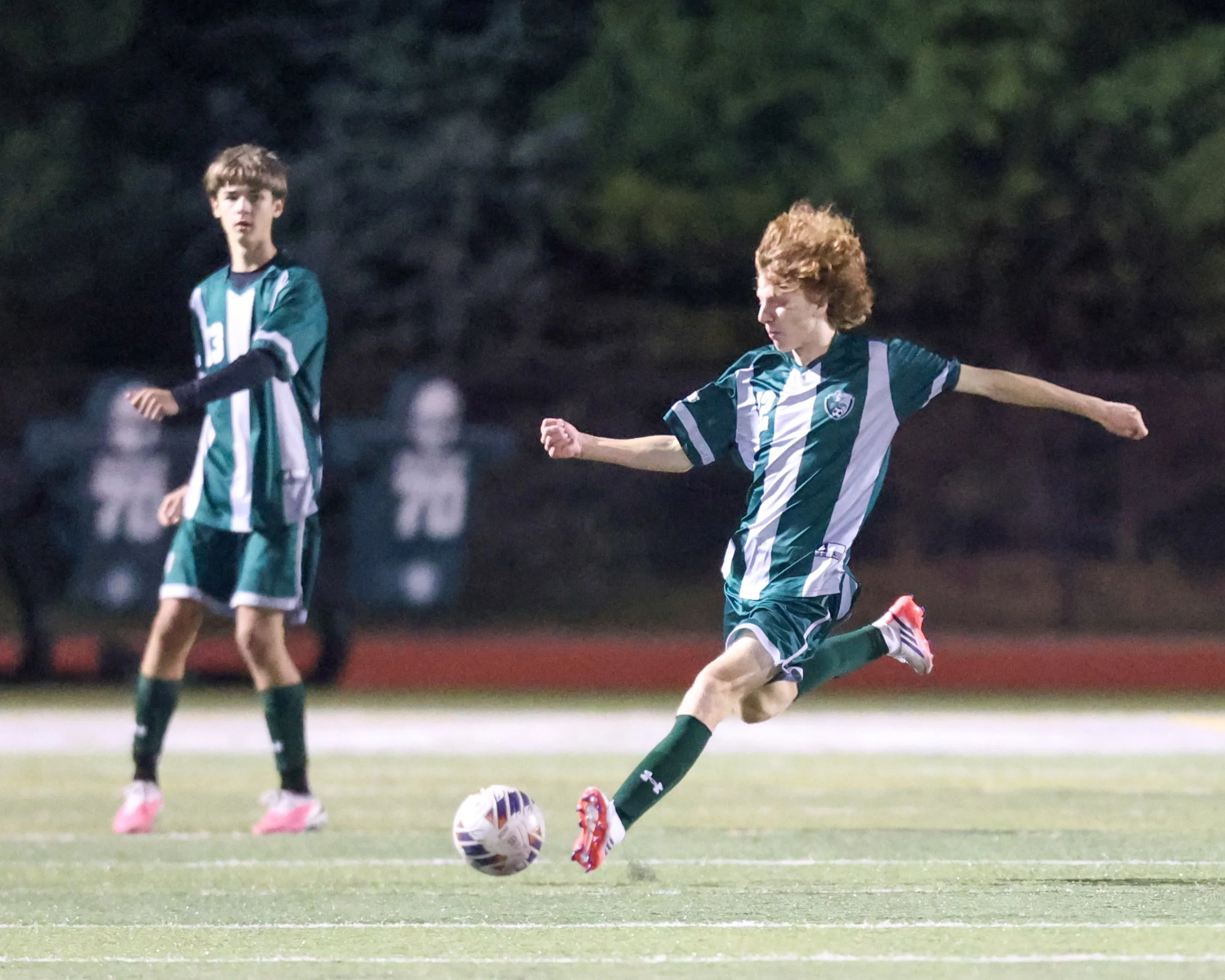 WK #12 kicks the ball