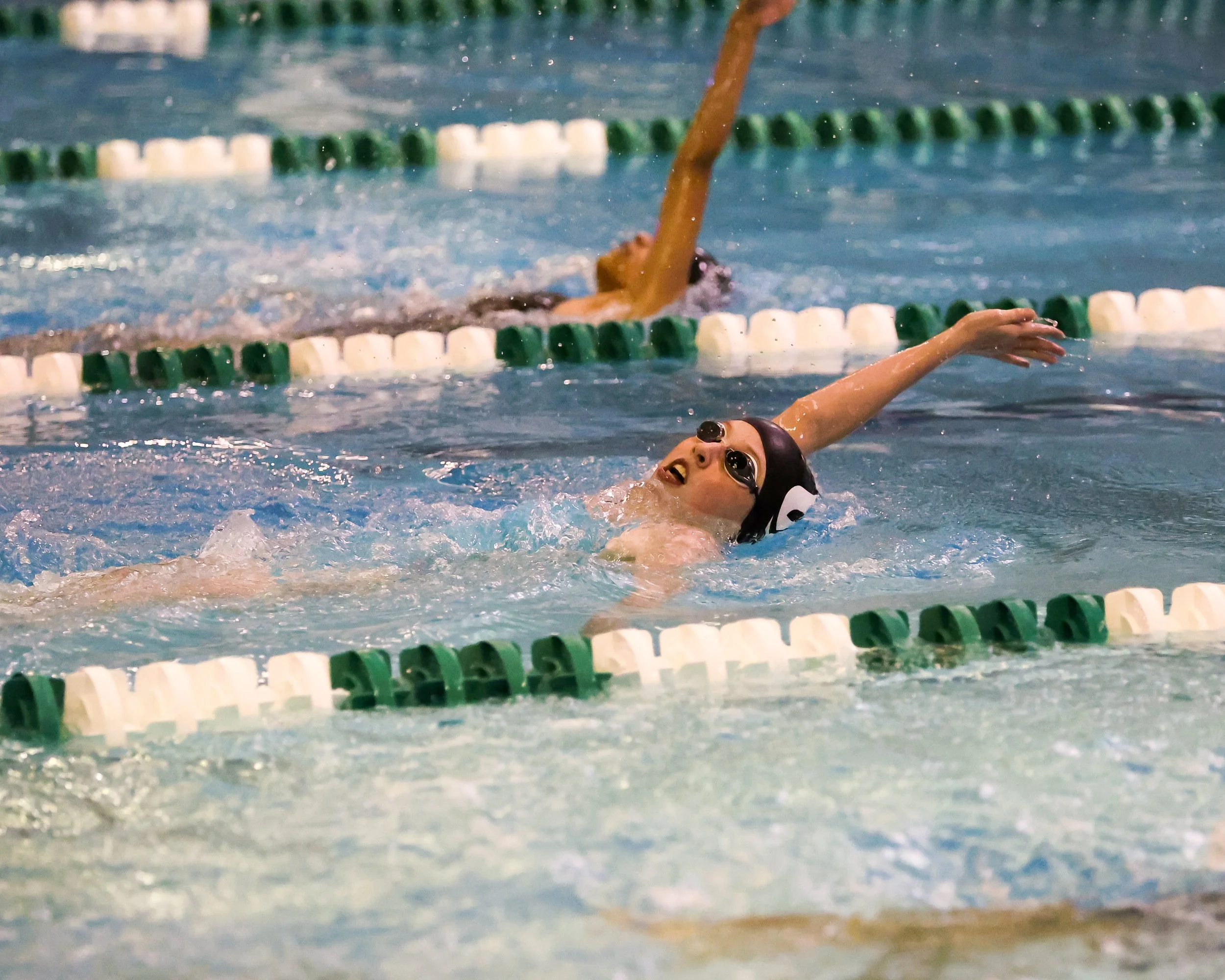 WU swimmer doing the backstroke