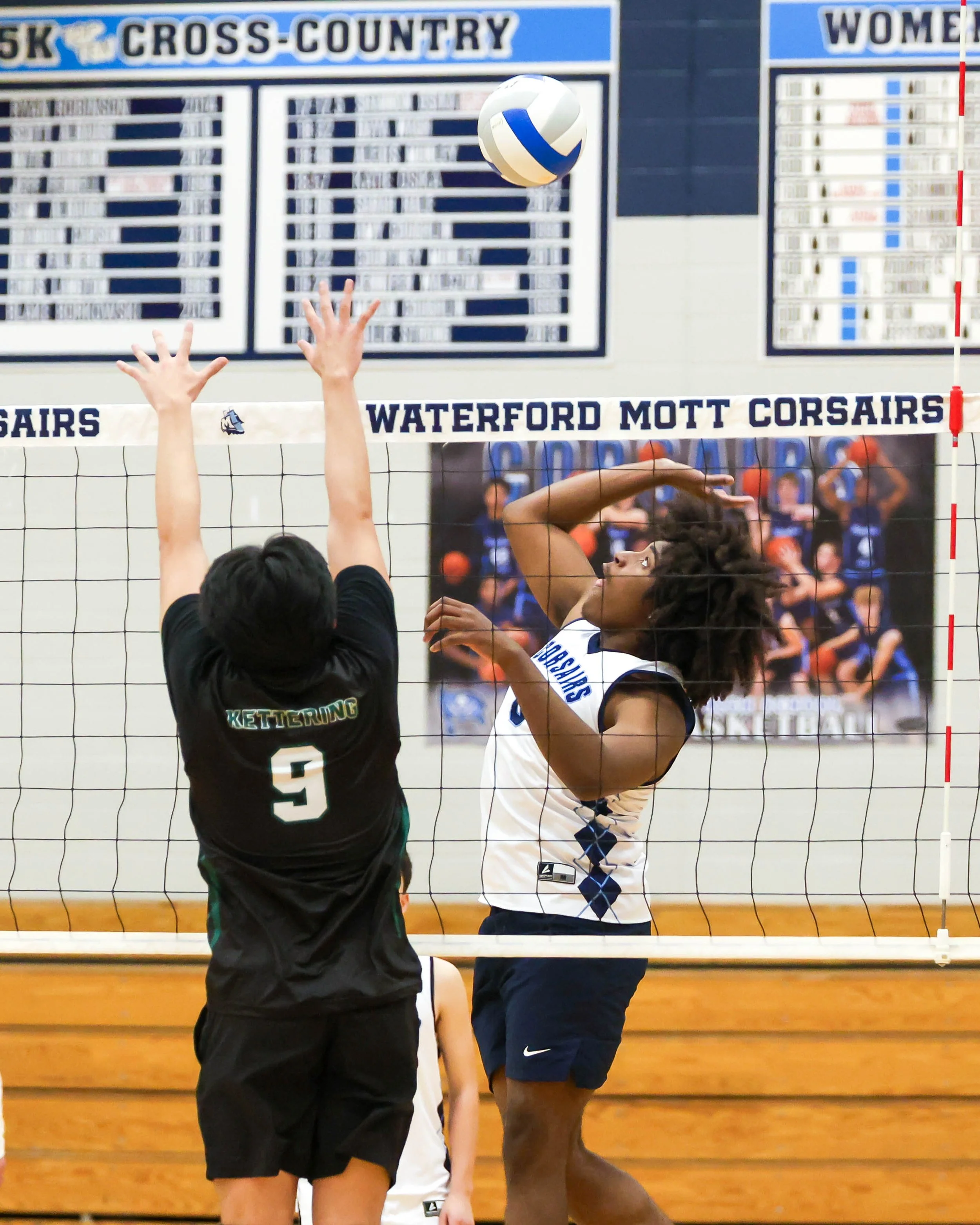 Mott #8 spikes the ball