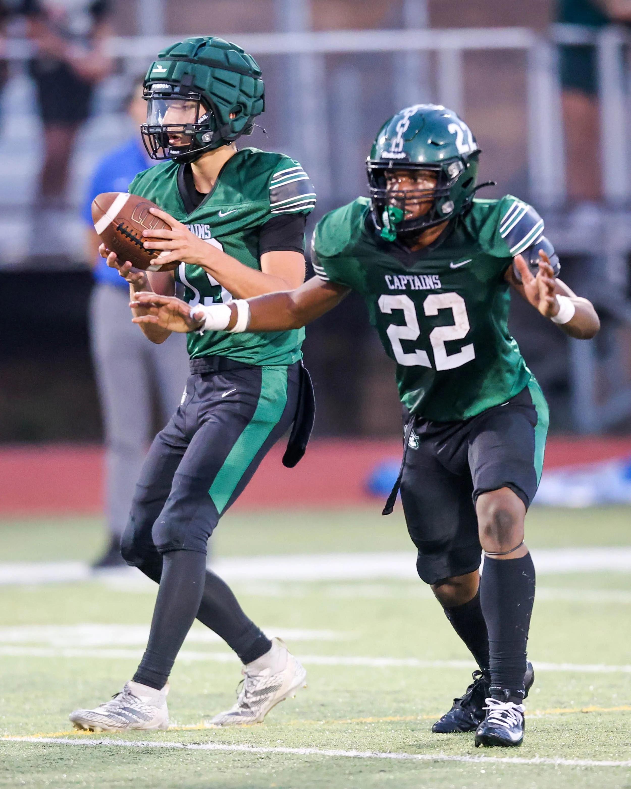 WK #13 with the ball and WK #22 ready to block 