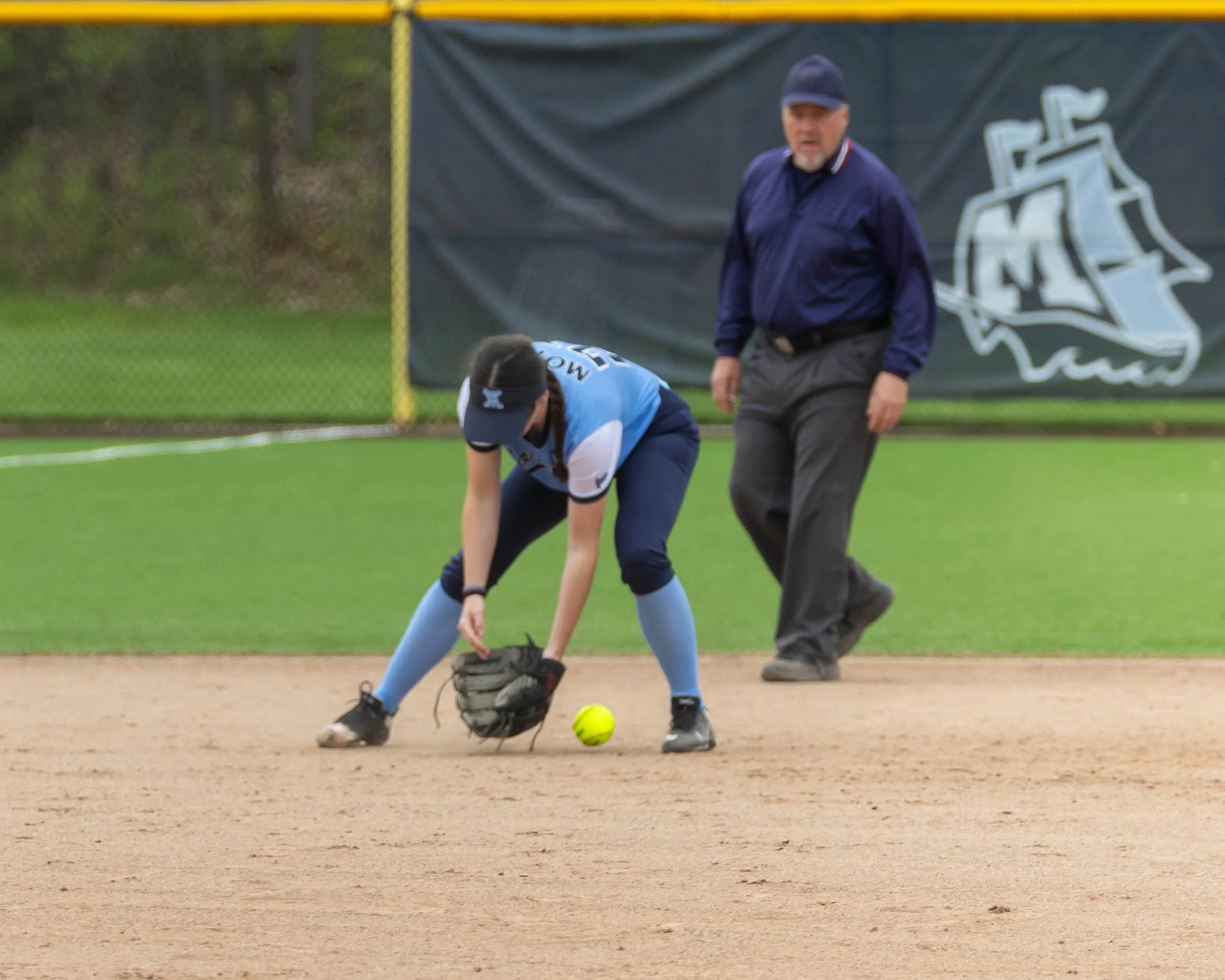 Mott short stop with the ball between her feet