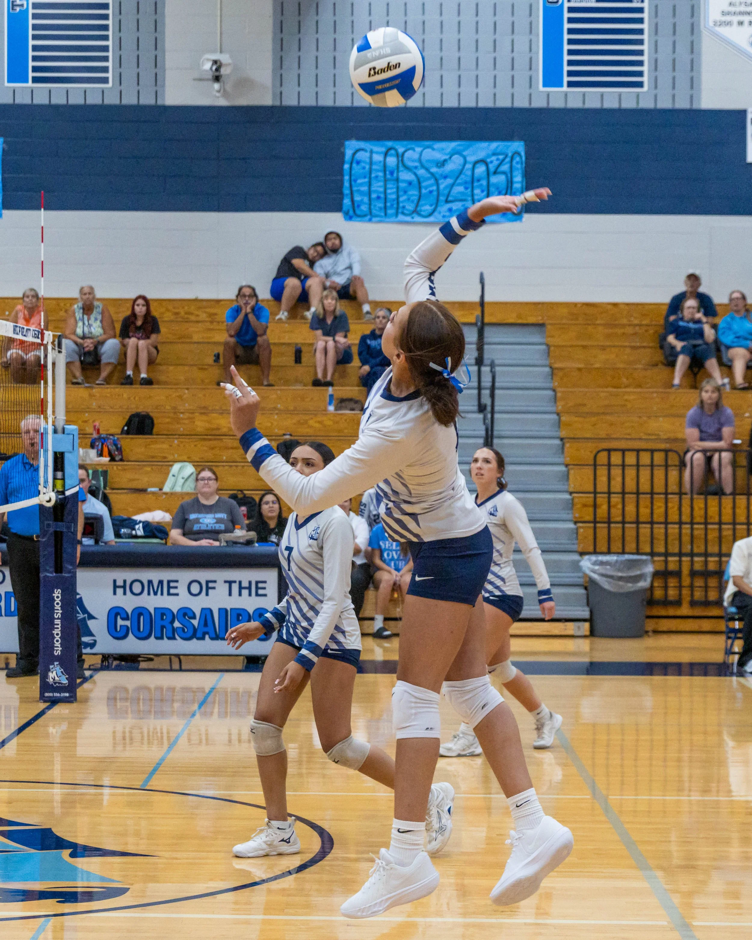 WM #1 spikes the ball 