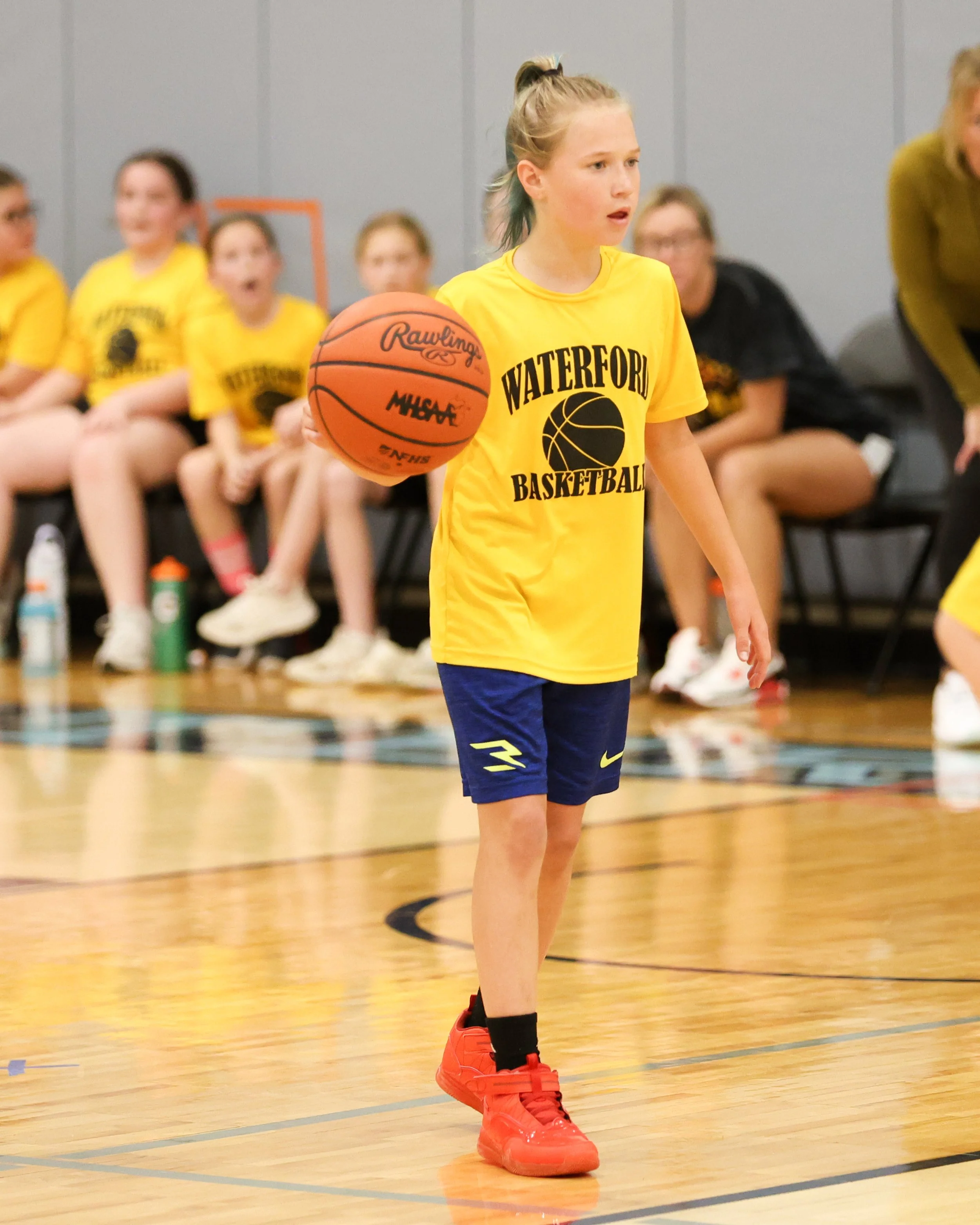 Schoolcraft girl dribbles the ball