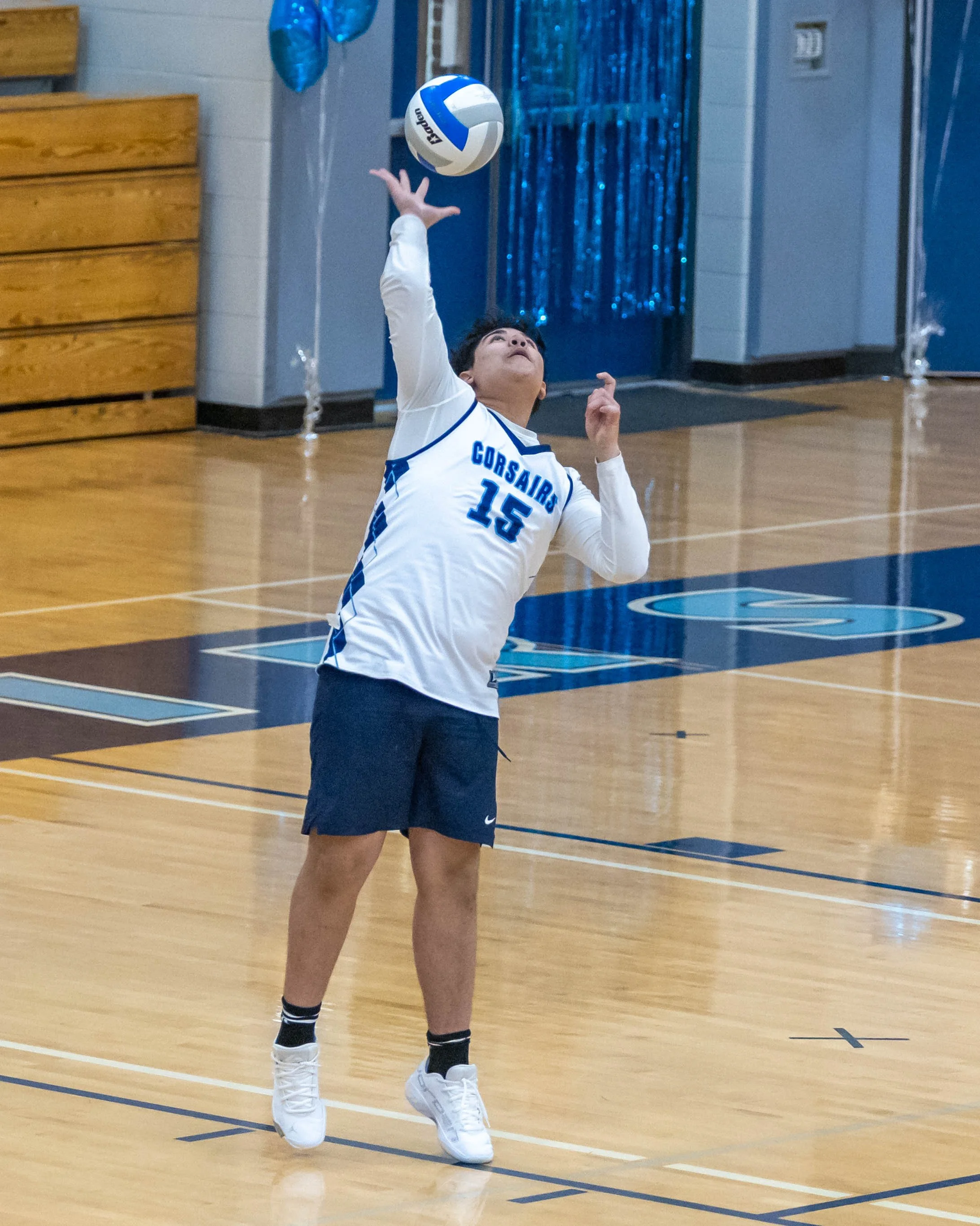 #15 serves the ball