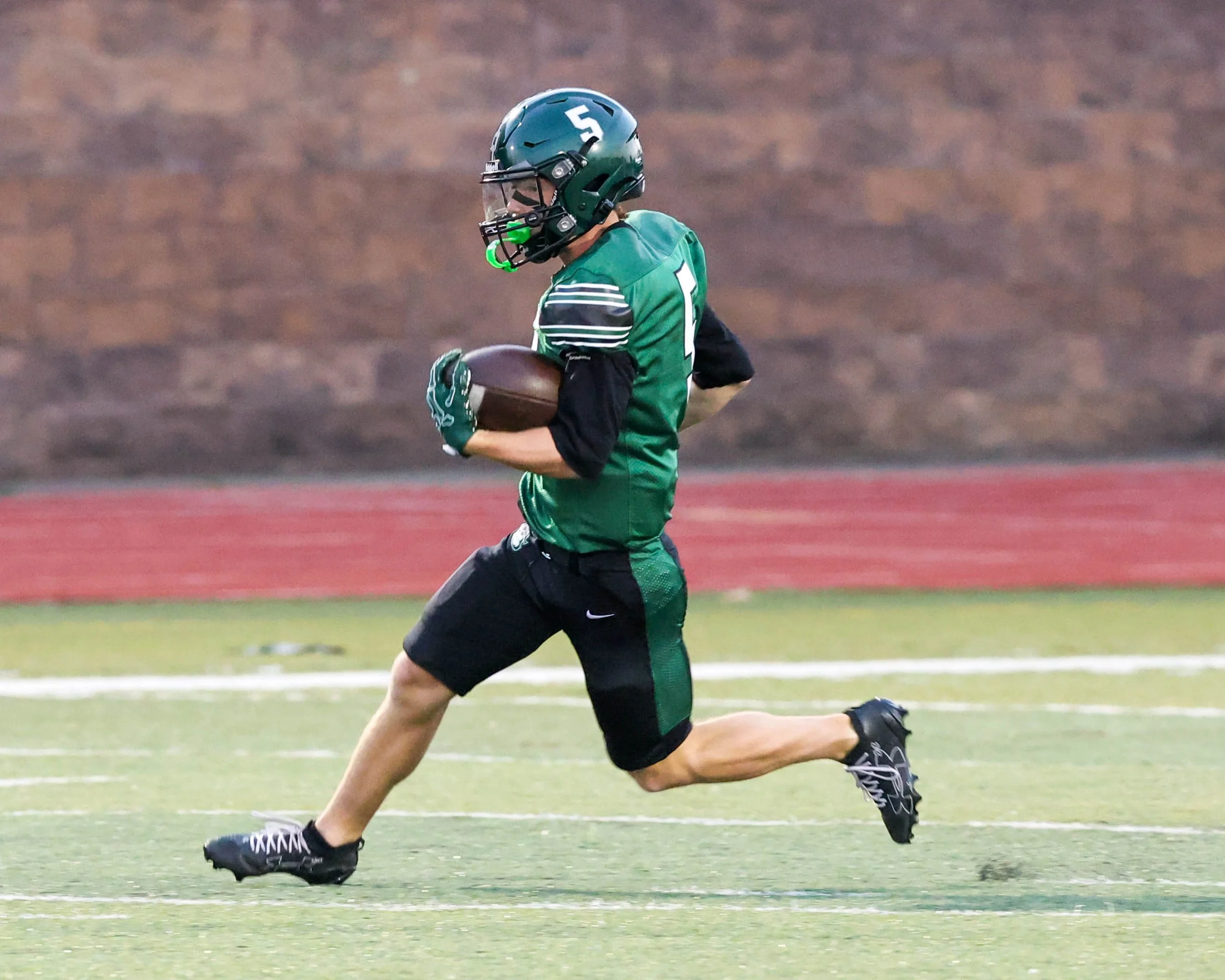 WK #5 returns a kickoff