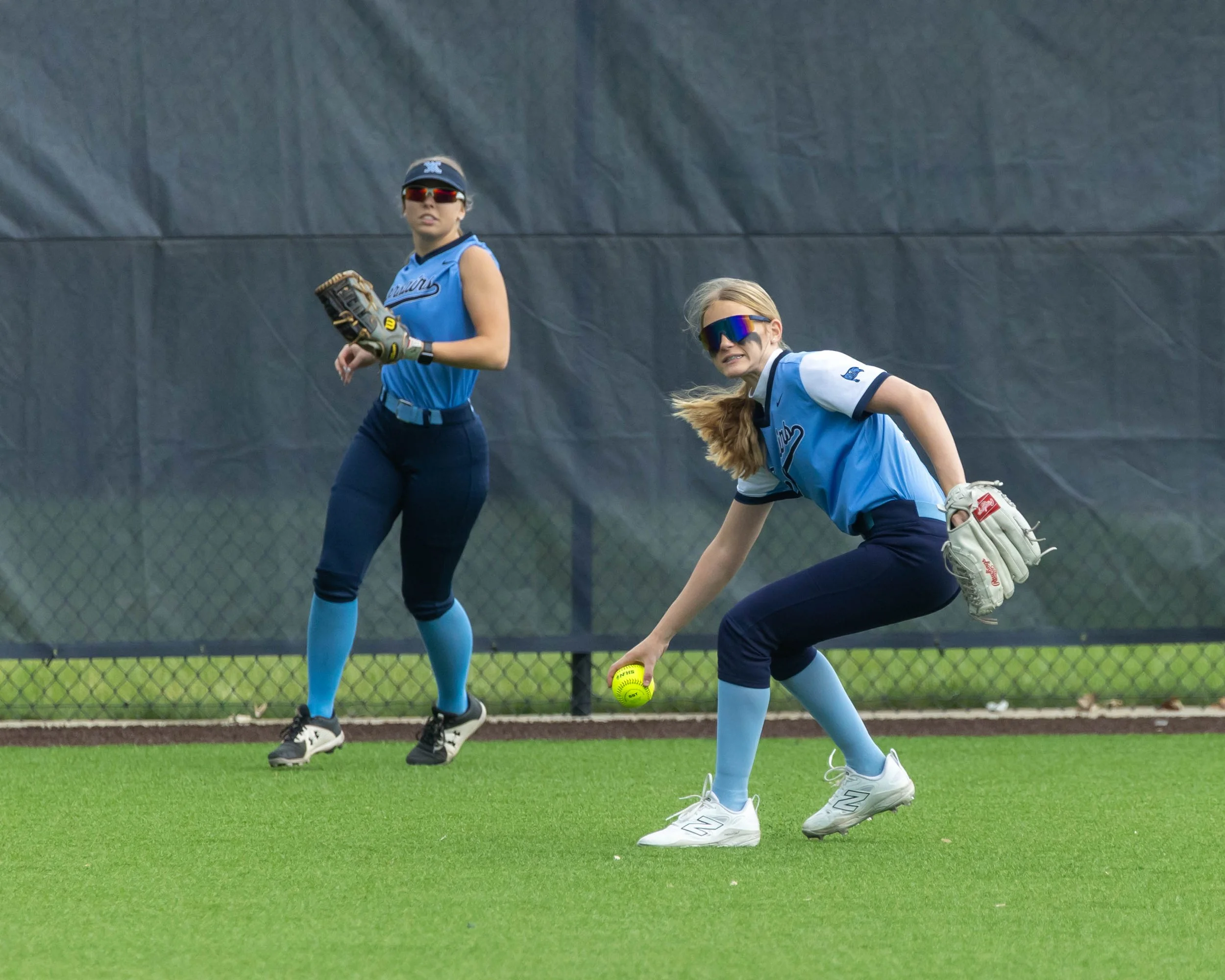 Mott left fielder picks up the ball