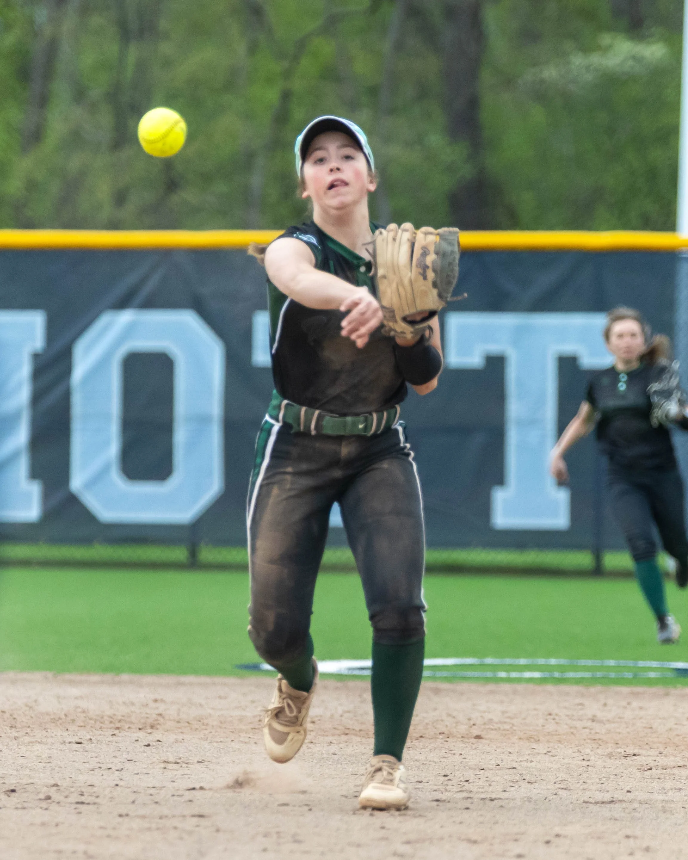Kettering short stop throws to first base