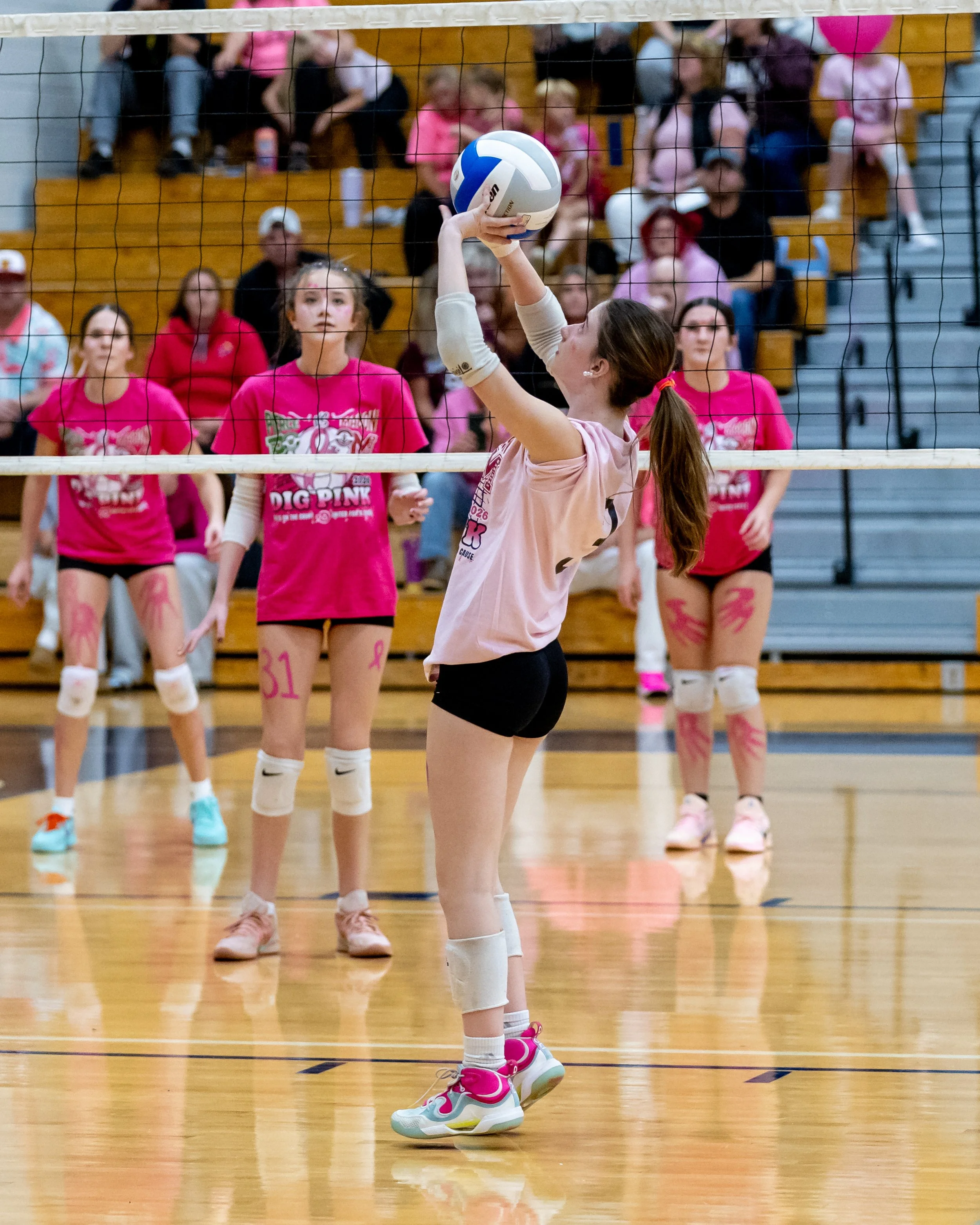 Mason player hits the ball