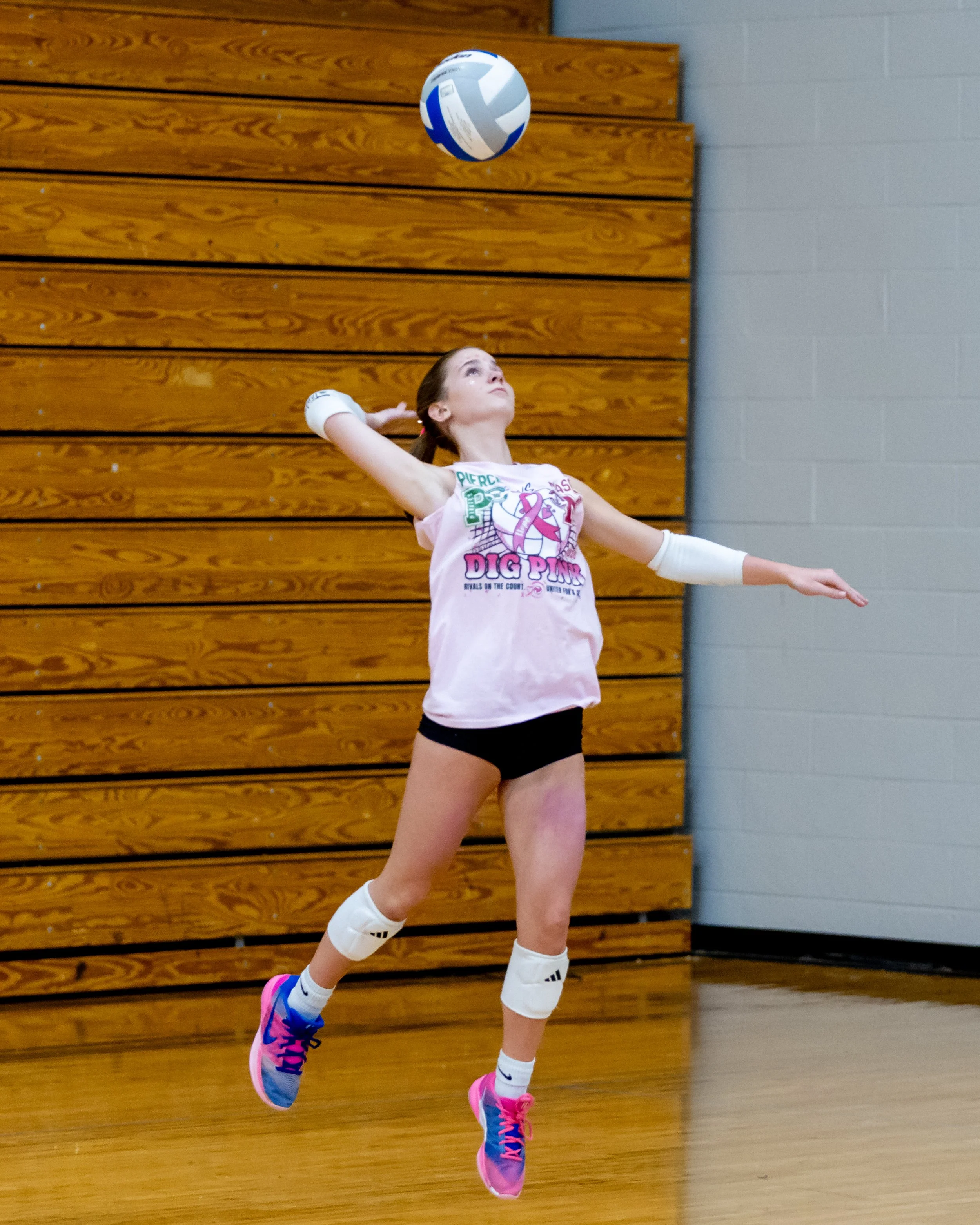 Mason player serves the ball
