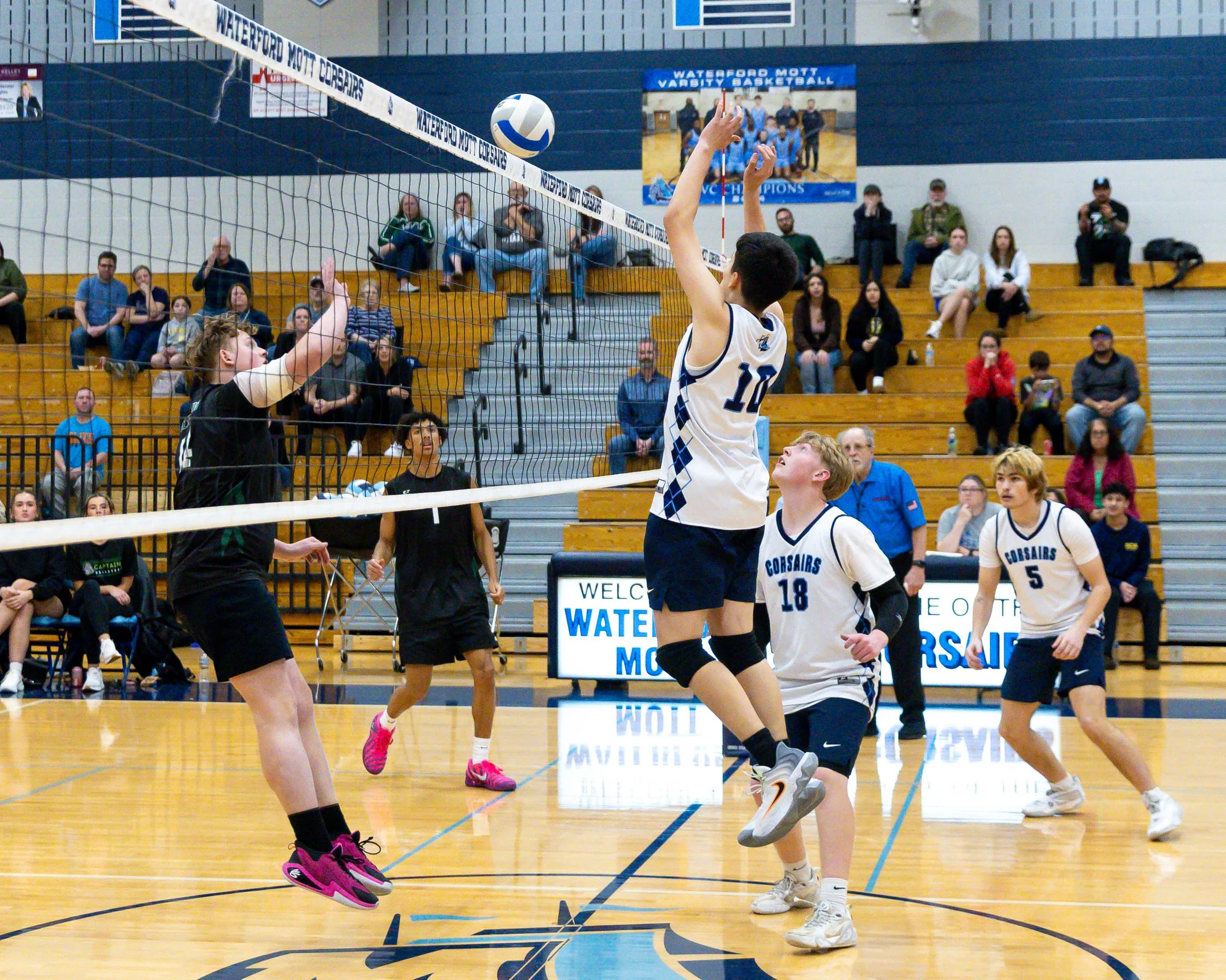 Ketting #14 returns the ball and Mott #10 tries to block