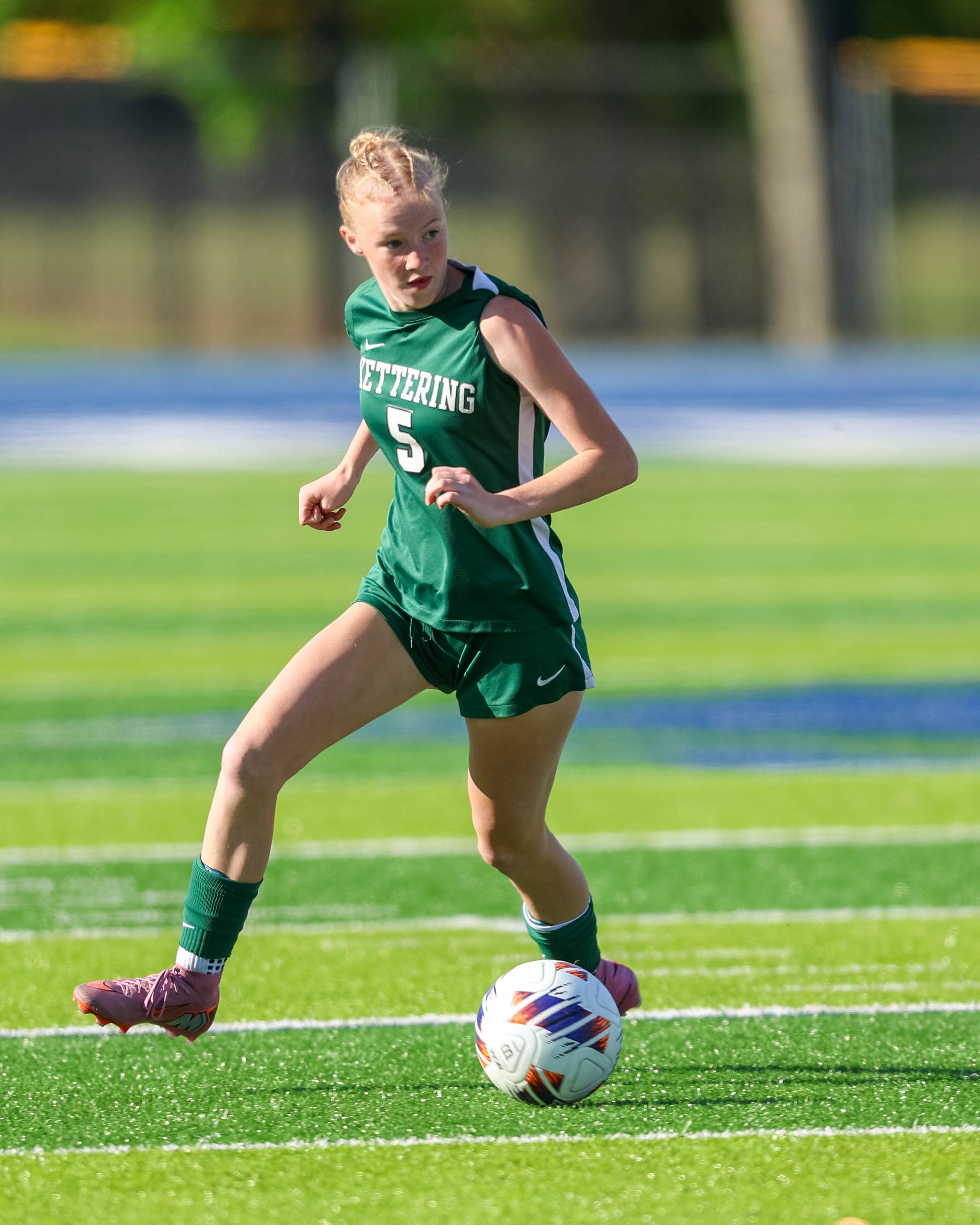 #5 with the ball at her feet