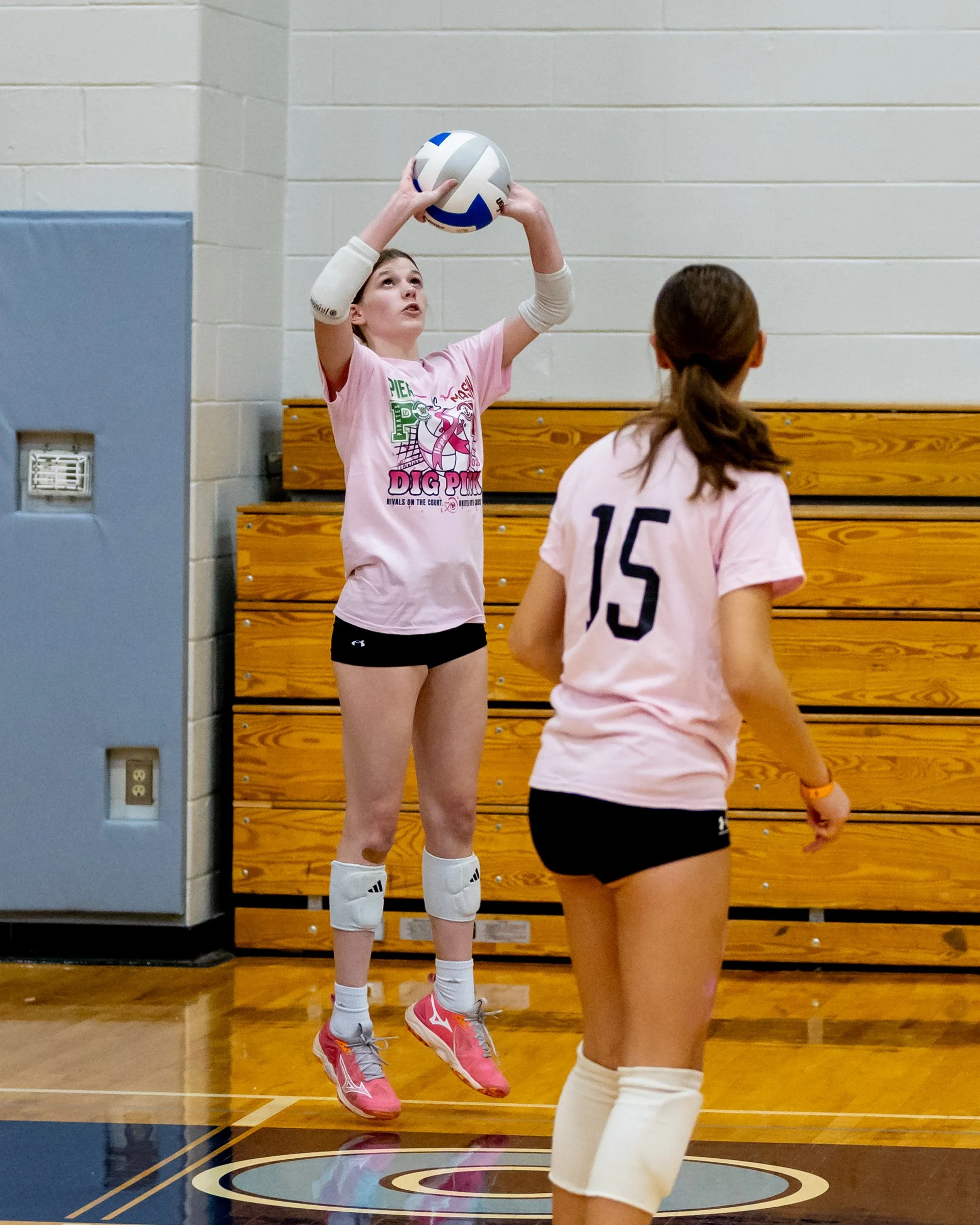 Mason player hits the ball