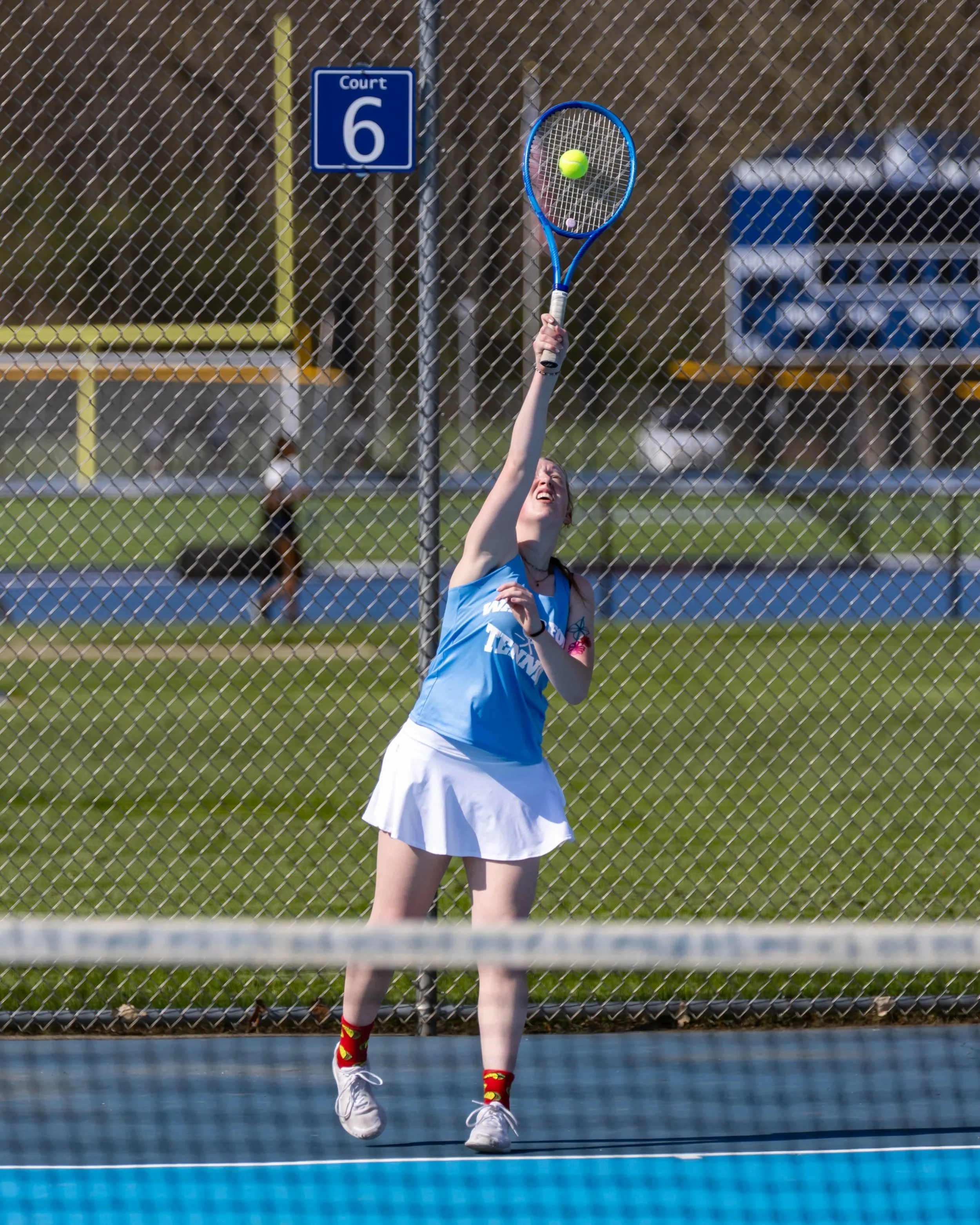 Waterford United player serves the ball