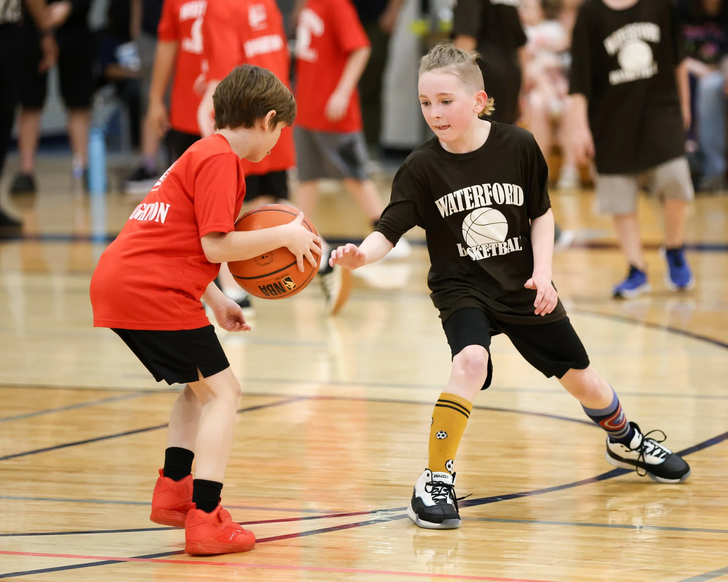 Houghton boy dribbles ball guarded by Haviland boy