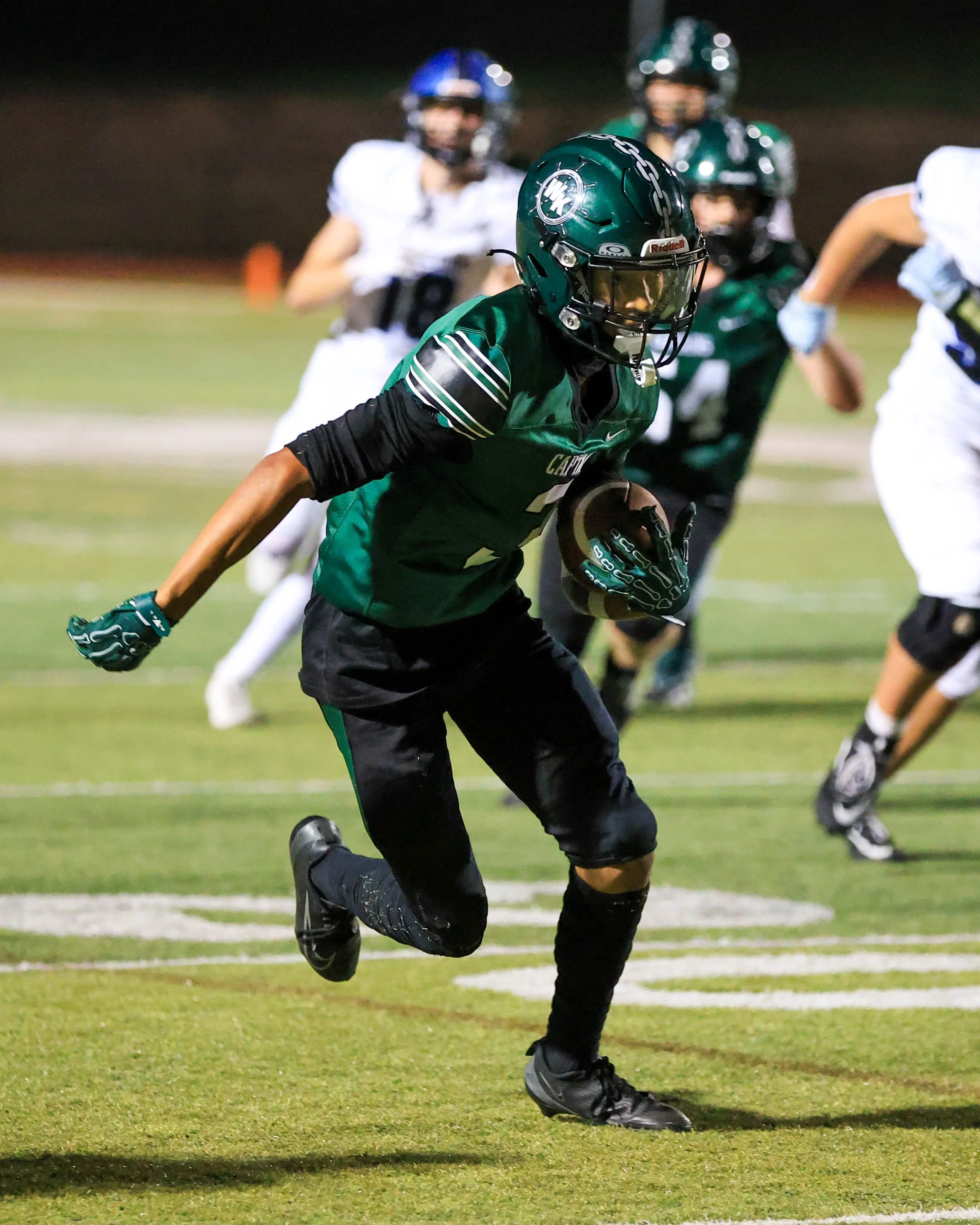 WK #2 catches the ball and runs