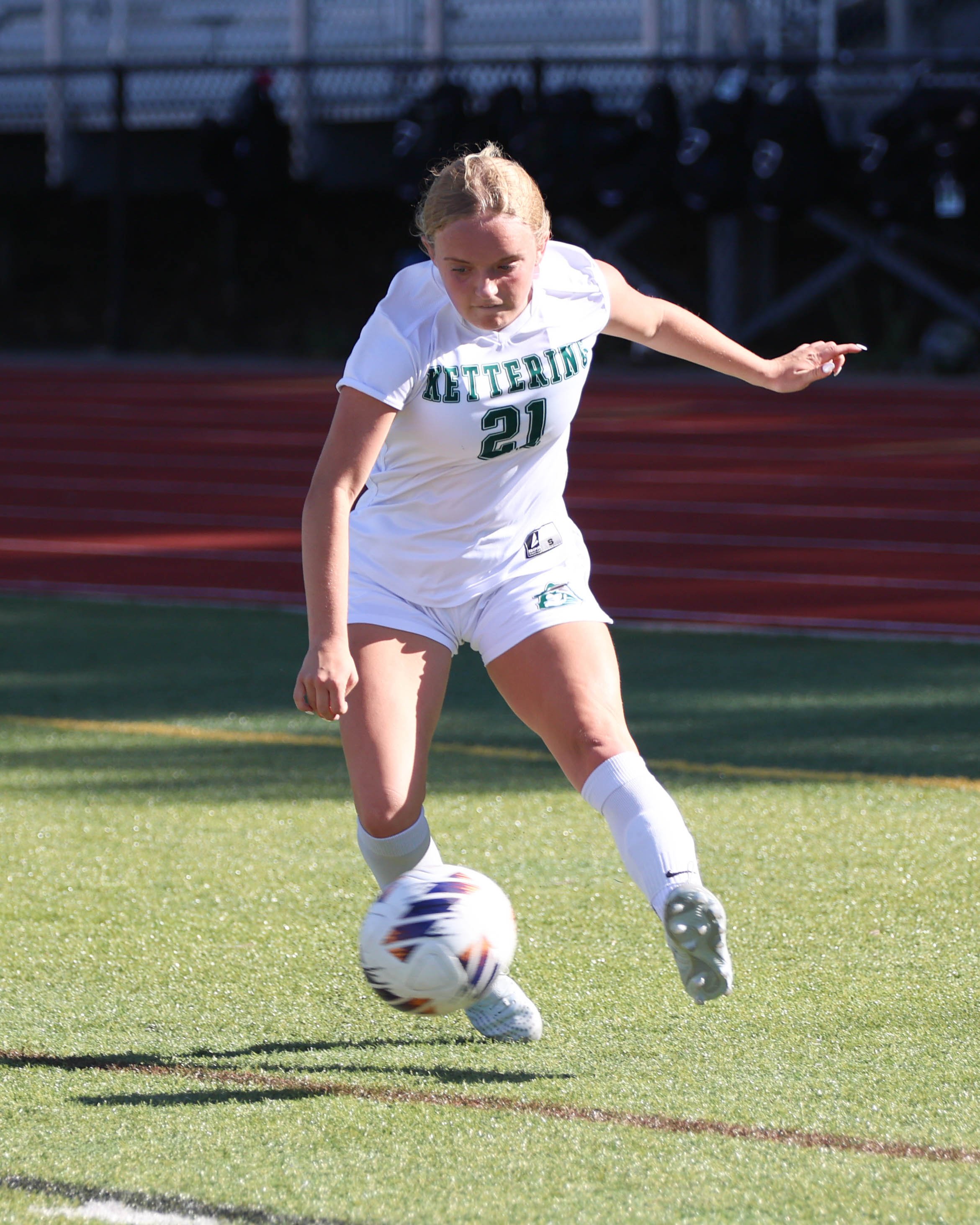 #21 kicks the ball