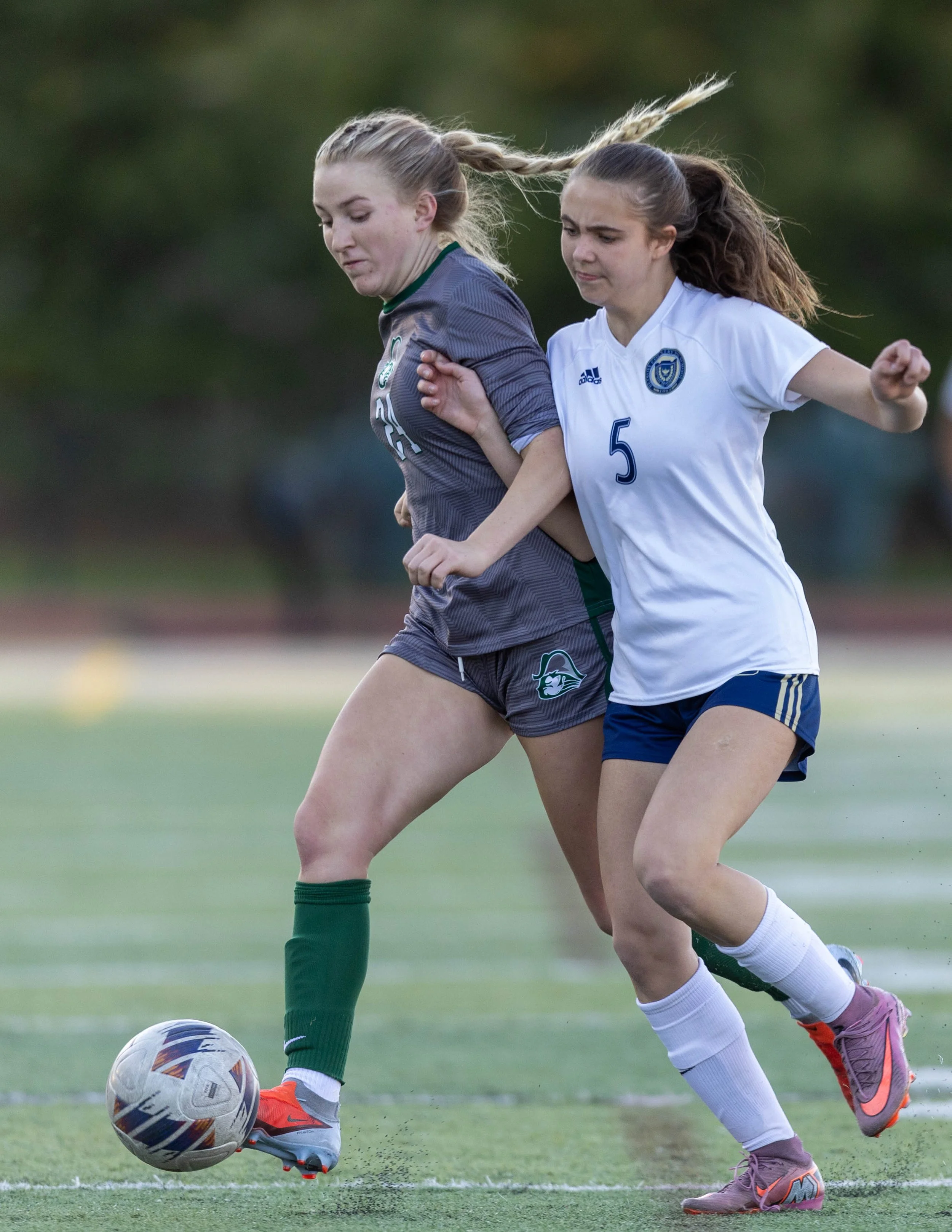 #24 and DCC #5 fight for the ball