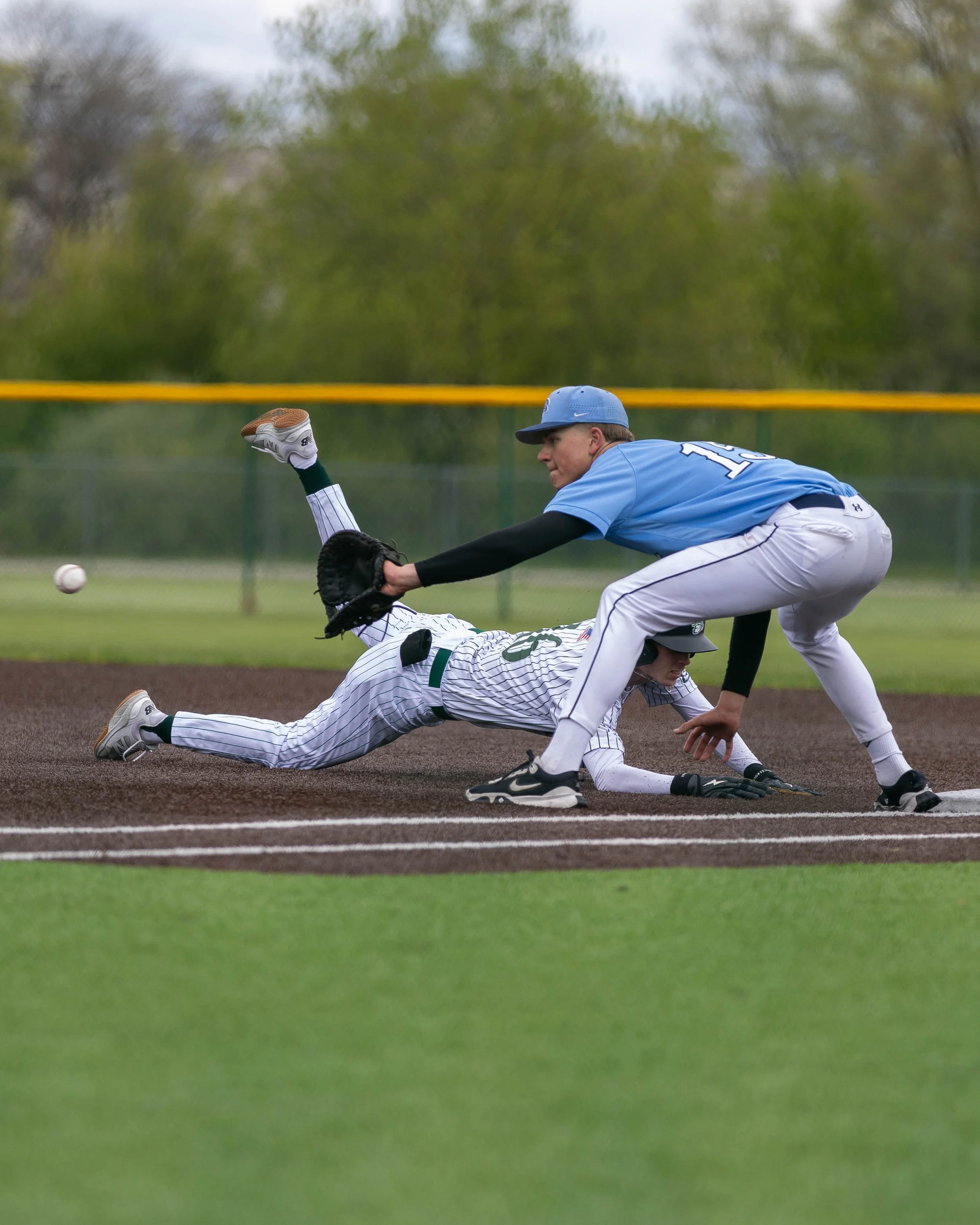 Mott #16 head first back to 1st base