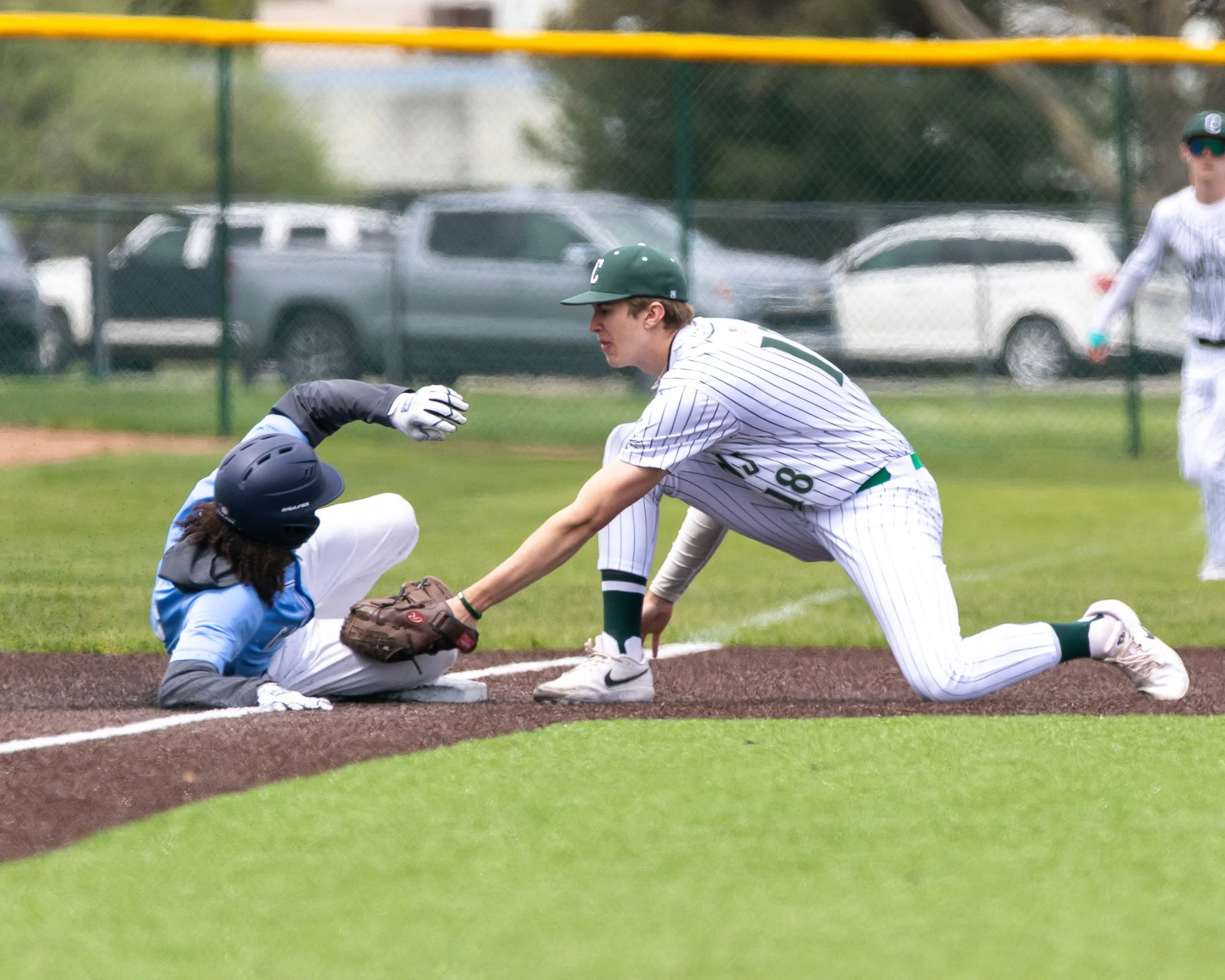 Mott runner on 3rd base tag by Kettering #18