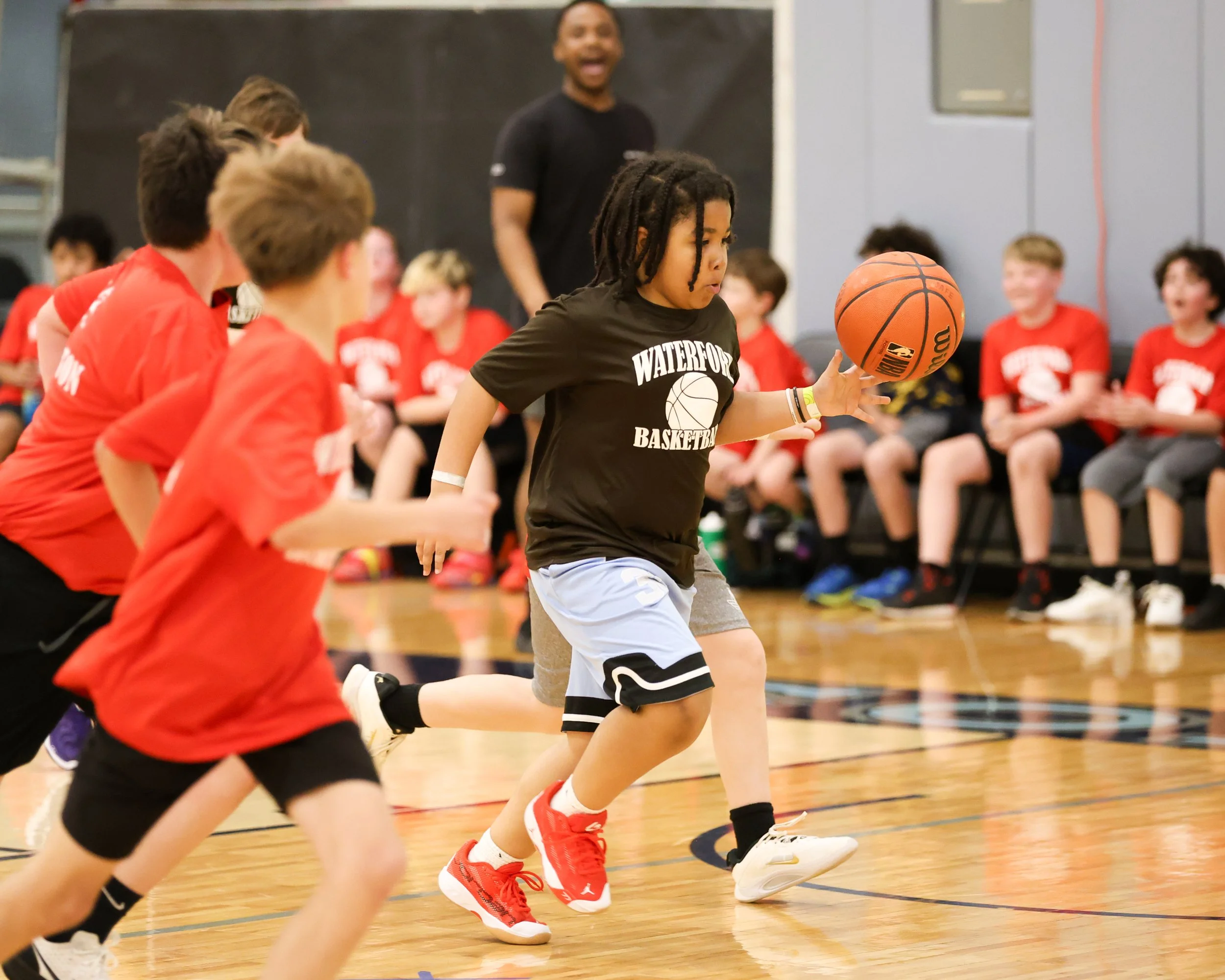 Haviland boy dribbles the ball past Houghton boys