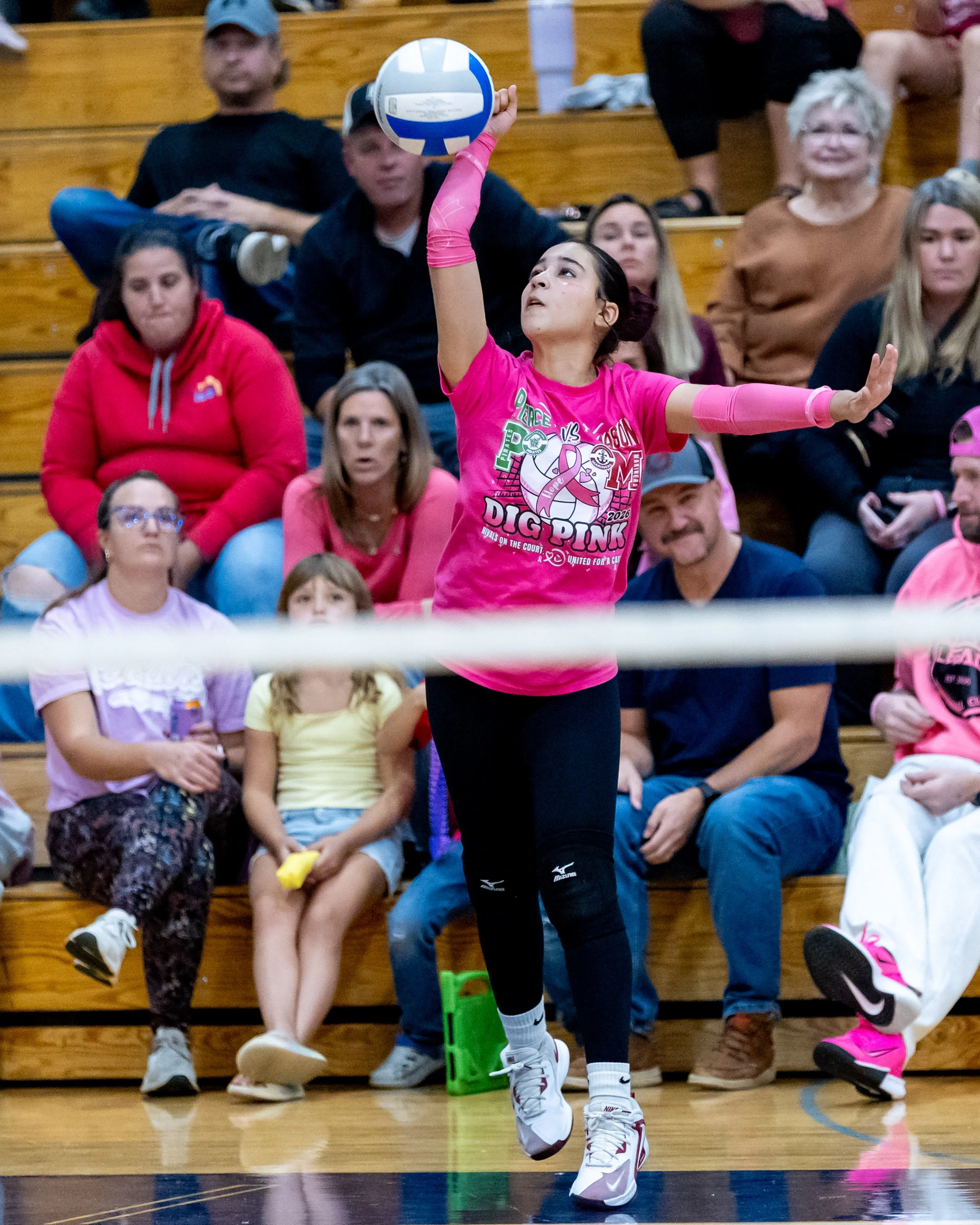 Pierce player serves the ball 