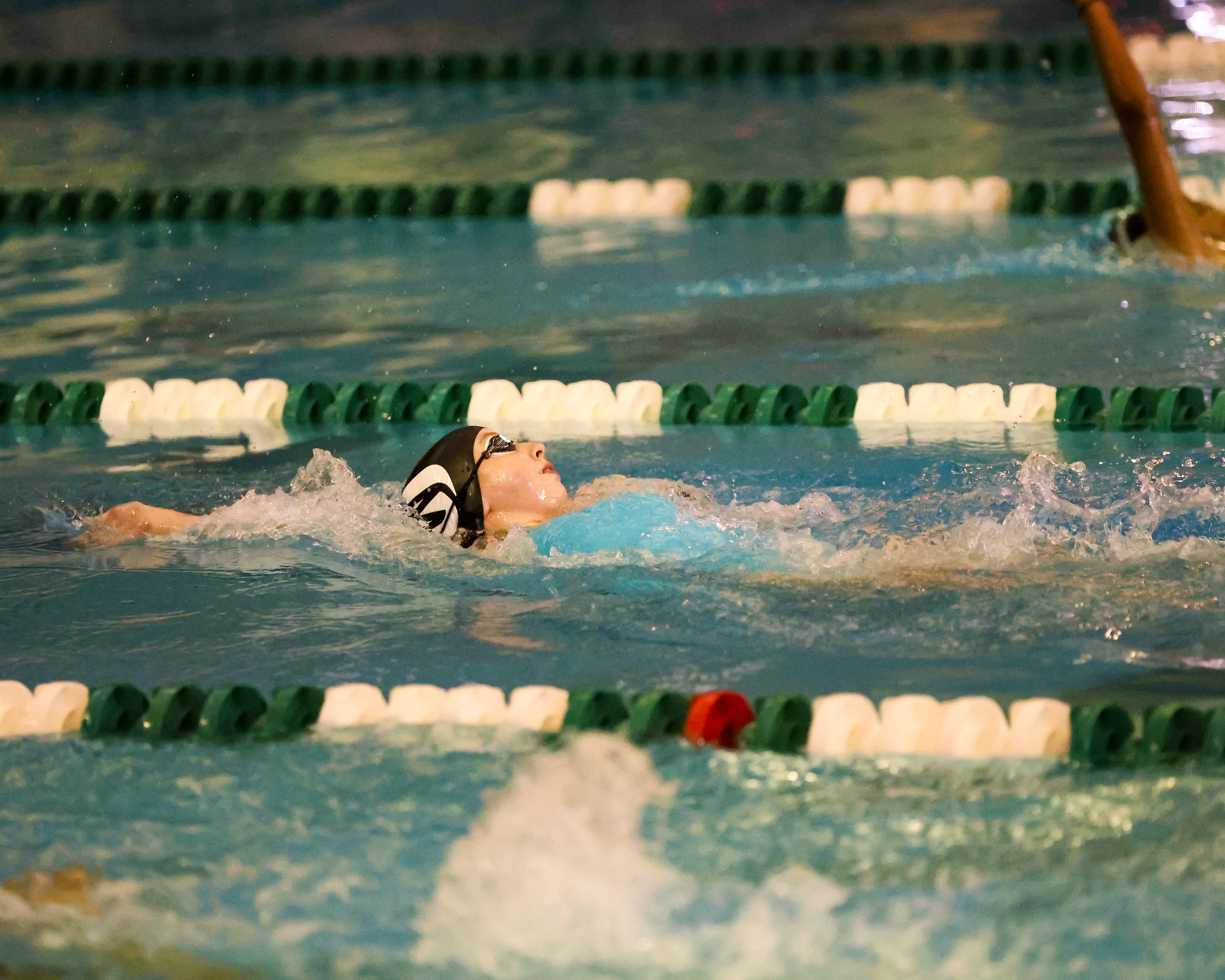 WU swimmer doing the backstroke